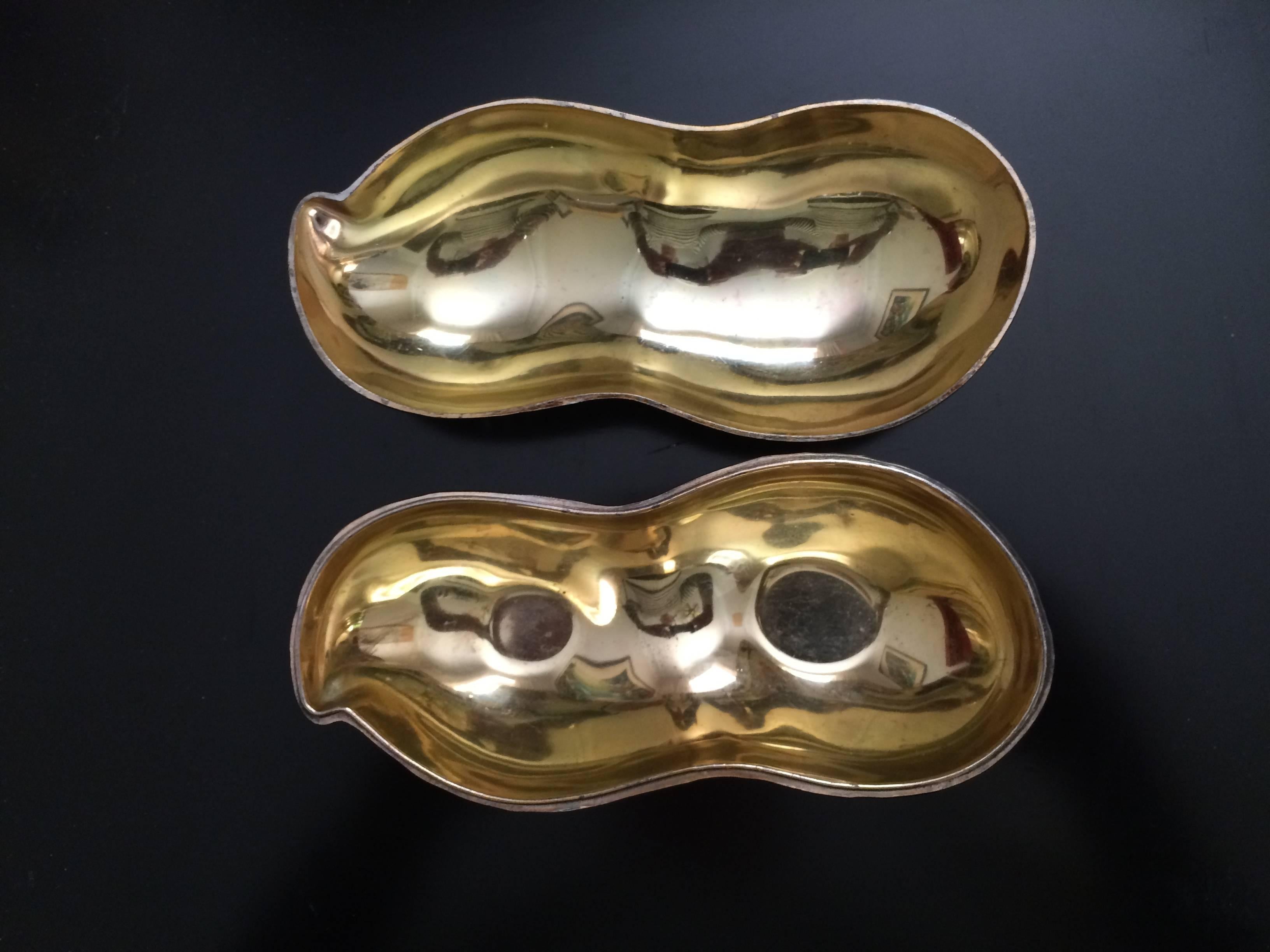 Silver Plated peanut dish by FB Rodgers. The inside is polished gold color.
 