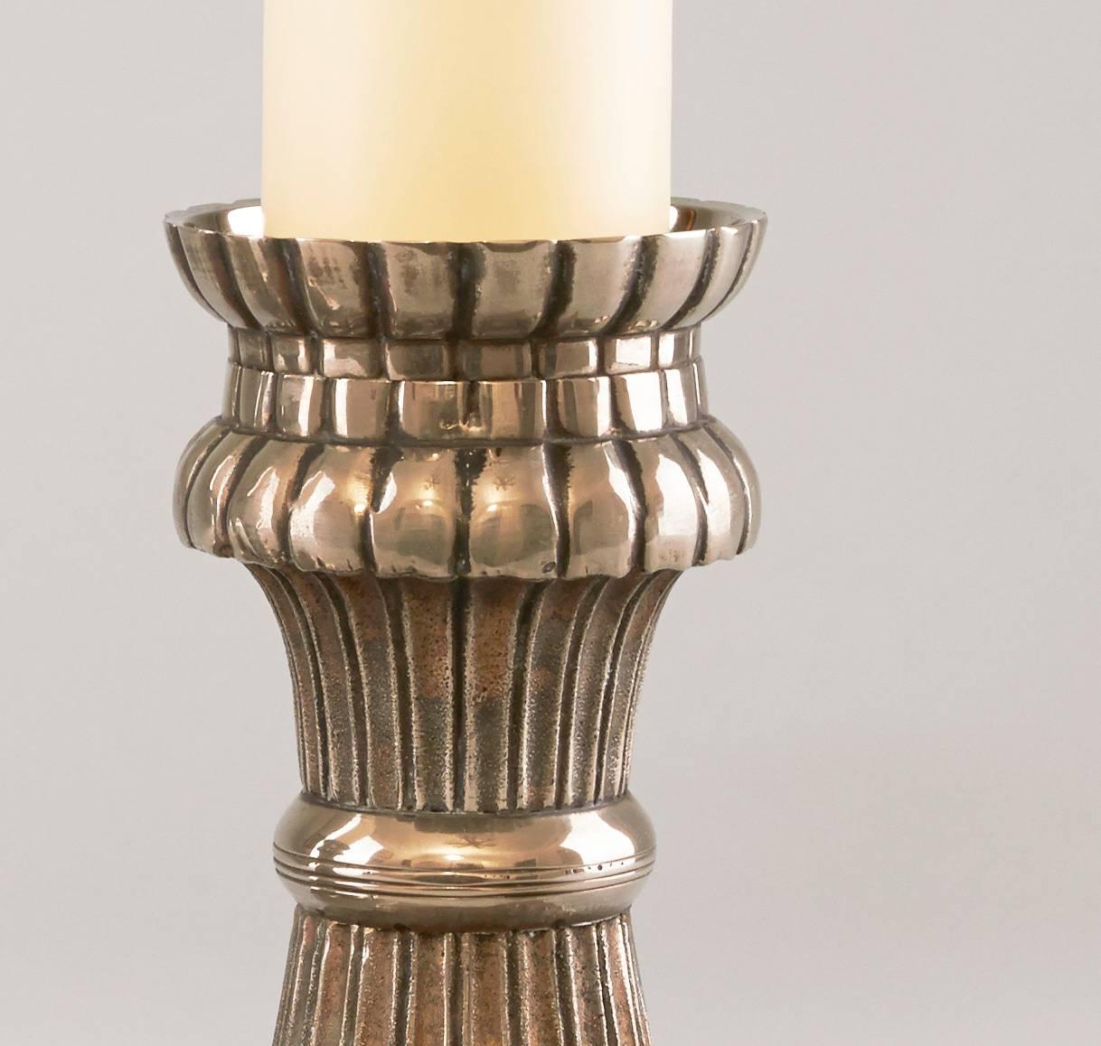 Pair of French nickel-plated metal candlesticks.