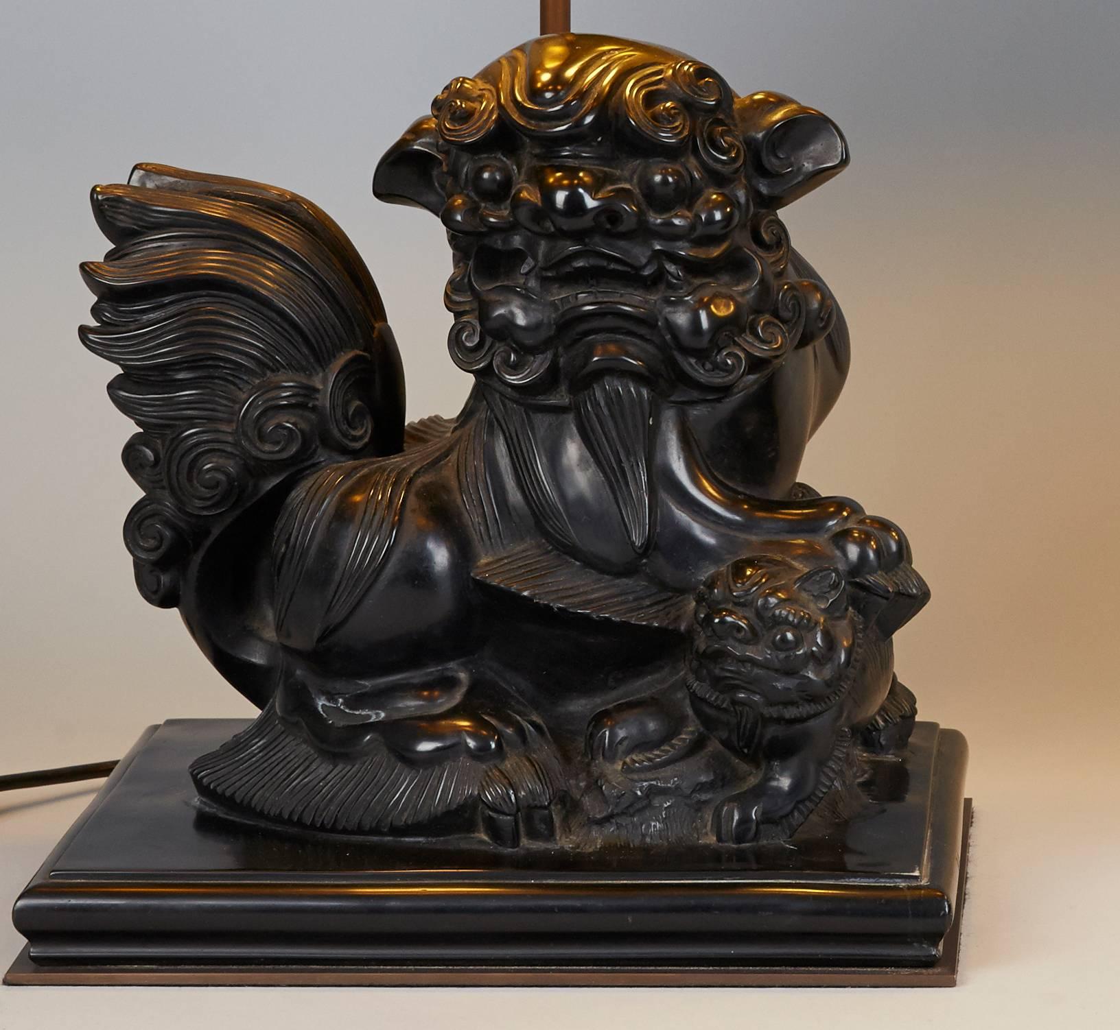 Chinoiserie Pair of Carved Cast Stone Foo Dog Lamps For Sale