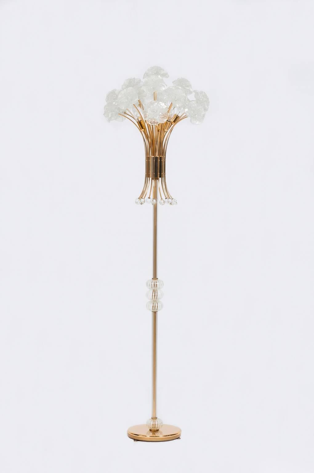 Spectacular Italian Murano floor lamp in very excellent original condition, attributed to Fendi, circa 1980s, composed by a gold frame with a glass stem with three sphere in the middle, and from glass flowers elements in iridescent color. The floor