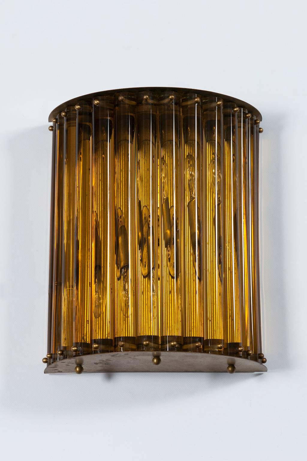 Massive single Wall Sconce in blown Murano Glass in amber color 1960s Italy.
This single sconce is a work of art that is adapt to be installed in yard or garden is properly protected from the rain, as well as inside a building. This is an