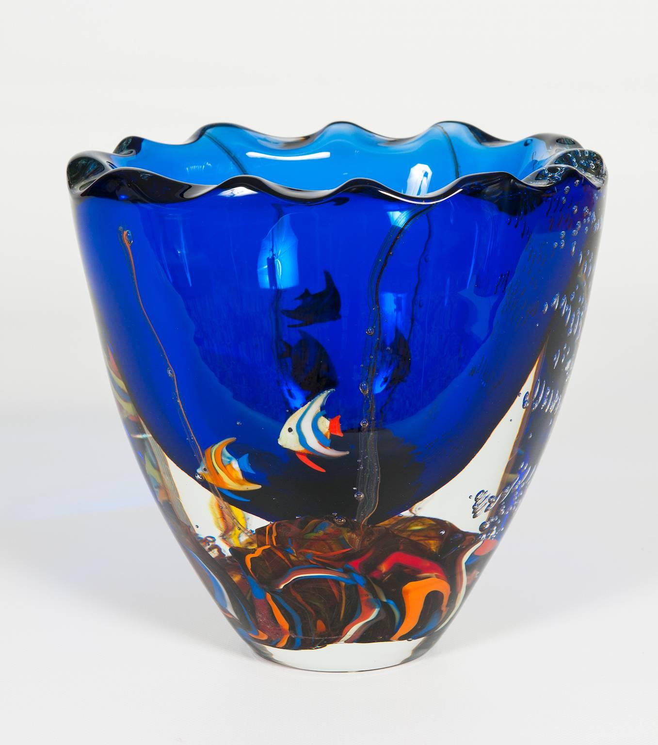 Massive Italian Vase Aquarium with fishes in blown Murano Glass, 1980s.
This is an authentic masterpiece Aquarium Vase, it is made up of a submerged ocean of fishes sculptures inside the vase itself.
 It is a fantastic ocean floor submerged with in