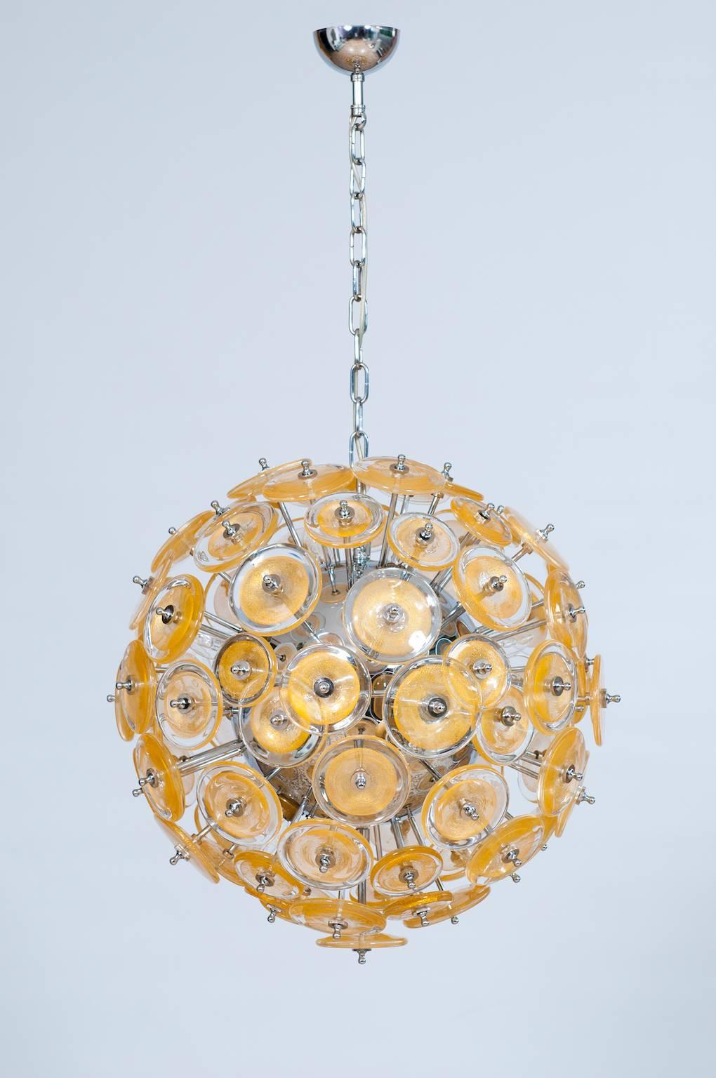 Amazing and Spectacular Italian Venetian, Flush Mount, Blown Murano Glass, Gold 24-K, composed by circular discs in transparent glass with in the middle a circular gold submerged leaf; all elements are accommodated in a chromed frame. 
The Flush