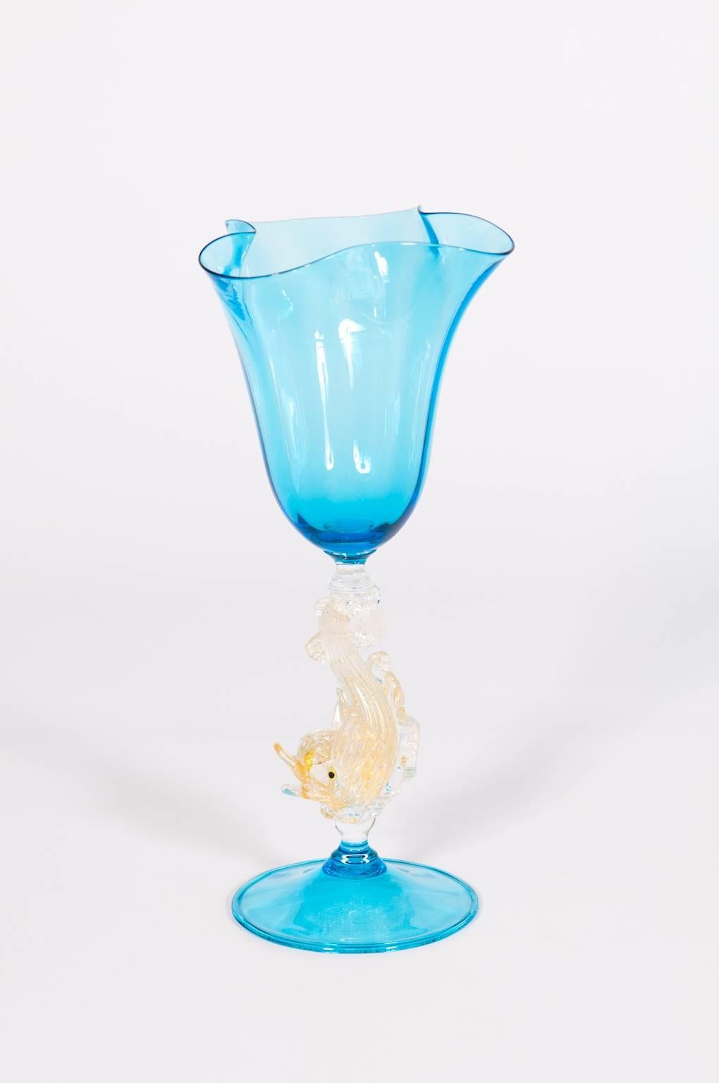 Elegant Italian Venetian handblown goblet in Murano glass composed by a base and a bowl with a very particular shape all in light-blue, and within the middle a fantastic very detailed fish in gold. All the parts are in very perfect condition. The