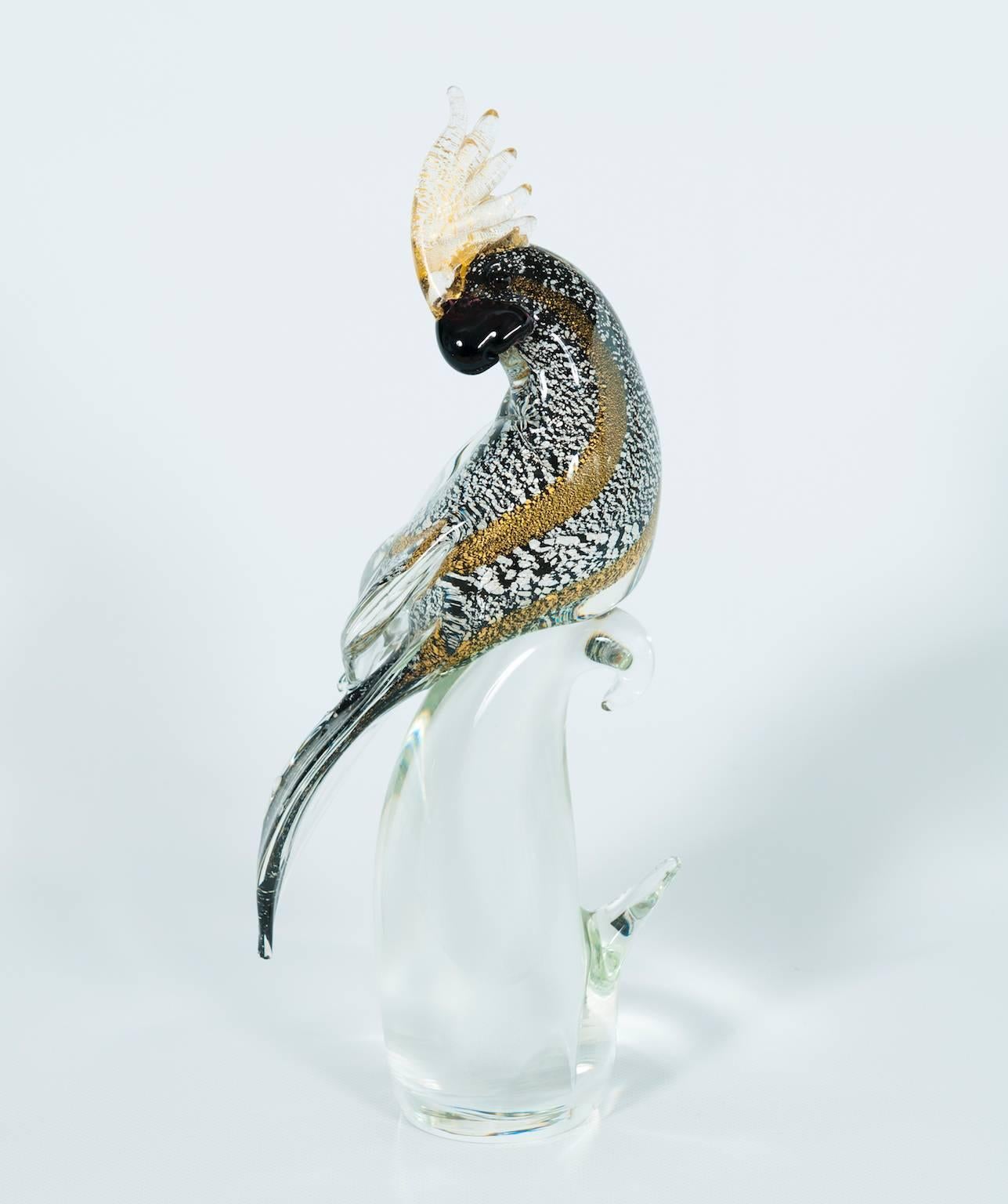 Unique Elegant Italian Venetian Sculpture Parrot in Murano glass, by Alberto Donà in 1980s, in very excellent original condition, composed by a transparent base signed in the bottom by Alberto Donà, with above a parrot in black, silver, gold and