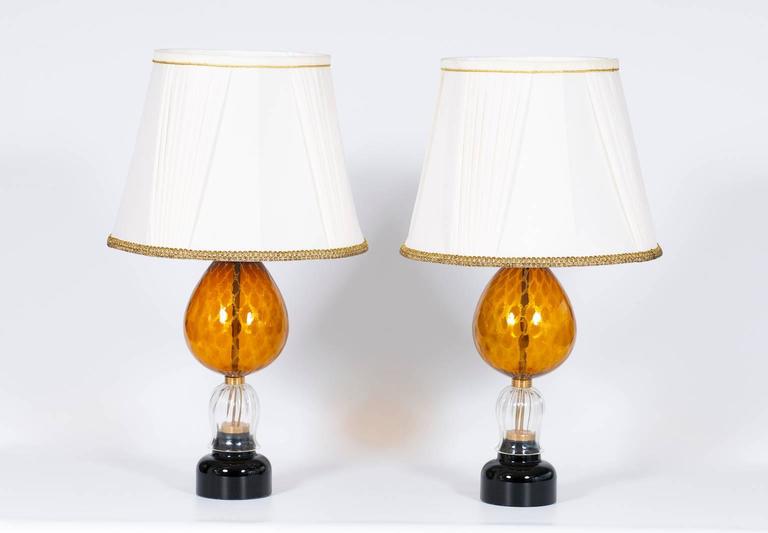 Elegant, and amazing, Italian Venetian, Pair Table Lamps, blown Murano Glass, Amber & Dark, composed by a black basement with above a transparent cup with stripe, and by an amber bowl with gold old honeycomb in the Murano glass body itself. The