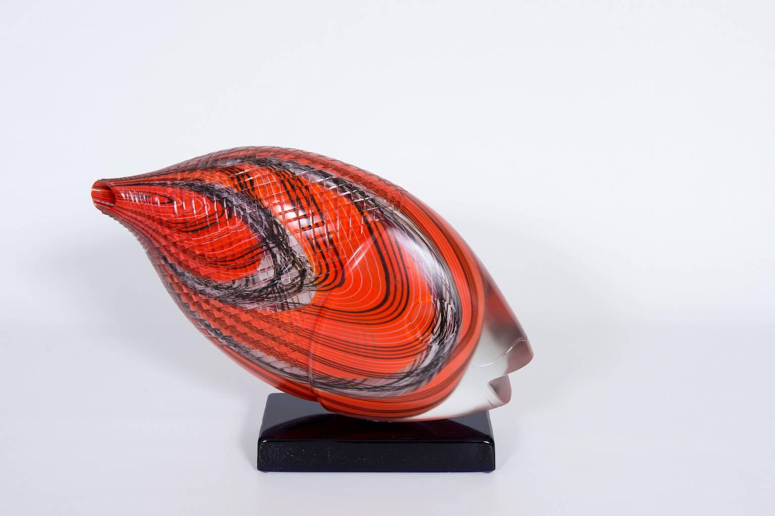 Astonished Italian Venetian, Fish Sculpture, Blown Murano Glass, Red, Opaque, Black, 1990s.
This amazing sculpture is composed by a black basement all in blown Murano glass, where the fish abstract sculpture is accommodated.
The abstract fish is a