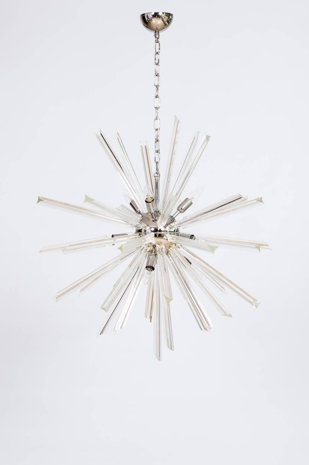 Italian Murano Sputnik chandelier in very excellent original condition, attributed to Venini circa 1970s, in a beautiful circular shape, composed from Murano glass transparent triedro elements. 
Measures: Height with chain: 49.21 in. / 125 cm.