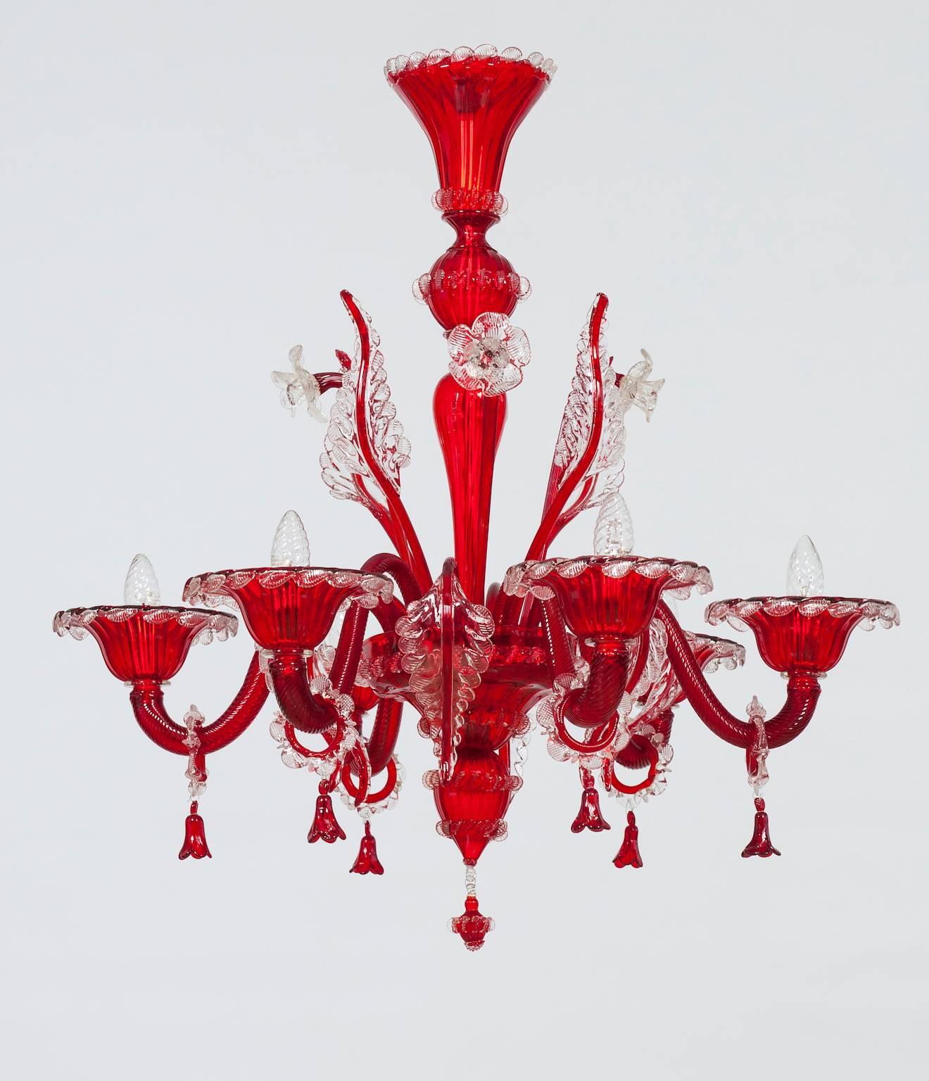 Elegant Italian Venetian, Chandelier, Blown Murano Glass, Red and Transparent, 1990s.
The  portrait is made up of six arms each one having a bulb, surrounded by flowers and leaves high and low, with transparent refinishing, in a red tone color. The