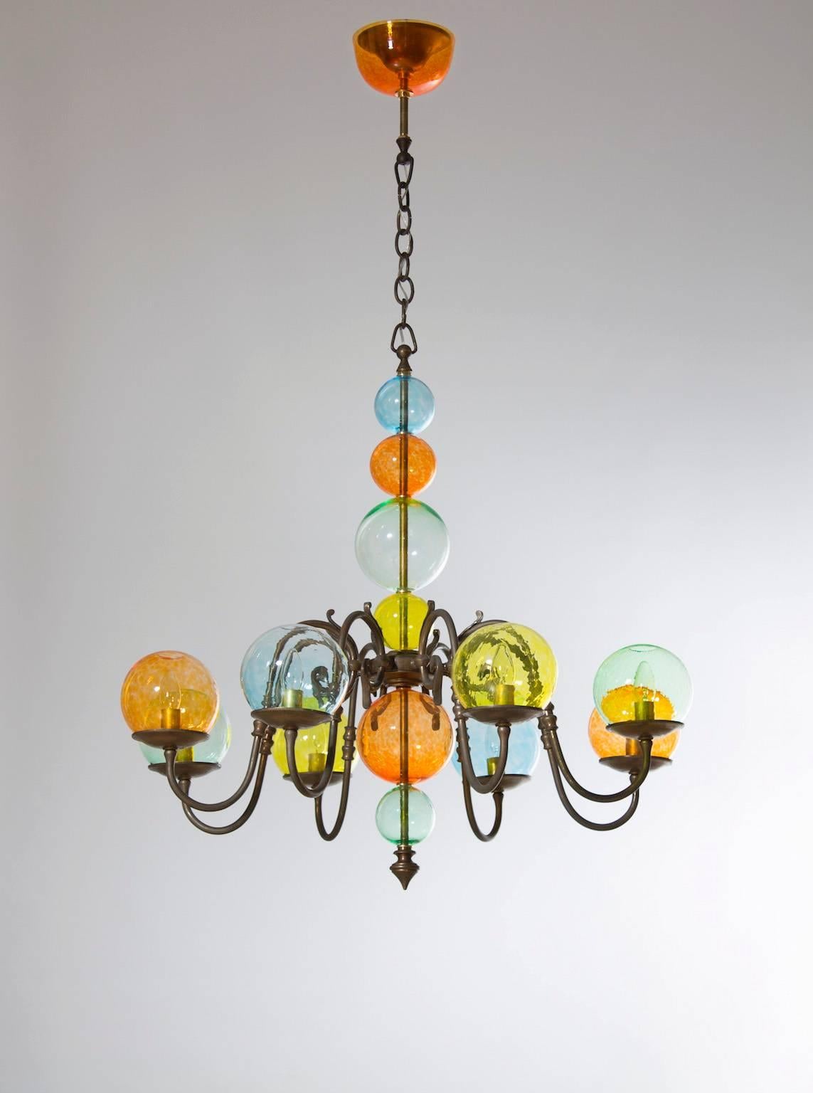 Special Italian Venetian, Chandelier, brass & colored blown Murano Glass bolls, 1960s,  in excellent original condition circa from 1960s, composed from a fantastic brass frame and from glass spheres in yellow, orange, green, and light-blue. The