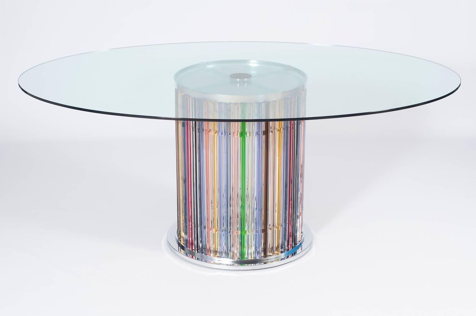 Amazing Murano dining table in excellent original condition circa from 1980s, composed in the stem from multicolor Triedro elements and with inside eight lights and with in the upper part a transparent top table in oval form. The table is 32 inch