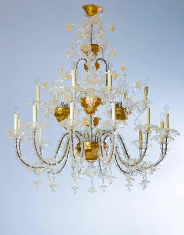 Italian Ca' Rezzonico Chandelier in Blown Murano Glass Gold 1950s
Elegant and massive Italians Venetian, Ca'rezzonico Chandelier, blown Murano glass, in transparent color with gold 24-karat finishes , composed by twelve arms in the lowest part of