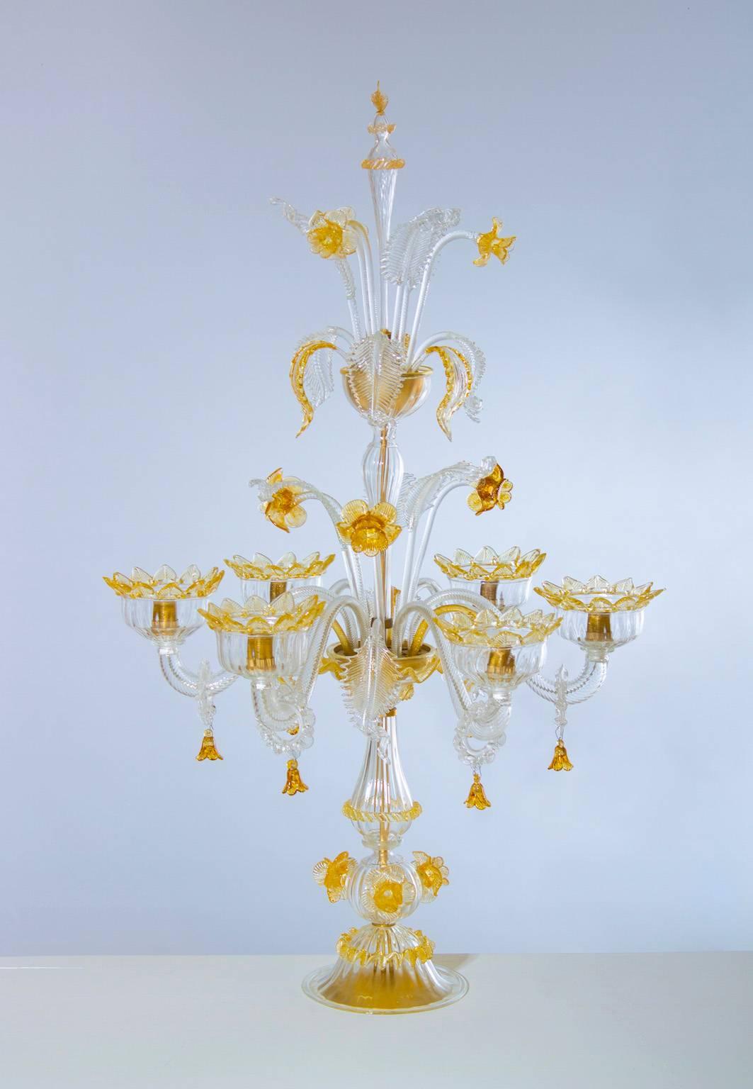 Amazing, Amber Flambeau Table Lamp Blown Murano Glass, 1990s Italy.
This an Italian Venetian, table lamp flambeau, in blown Murano glass, amber and clear color, composed by two gardens. 
In the lower garden having the six arms, low and high leaves,