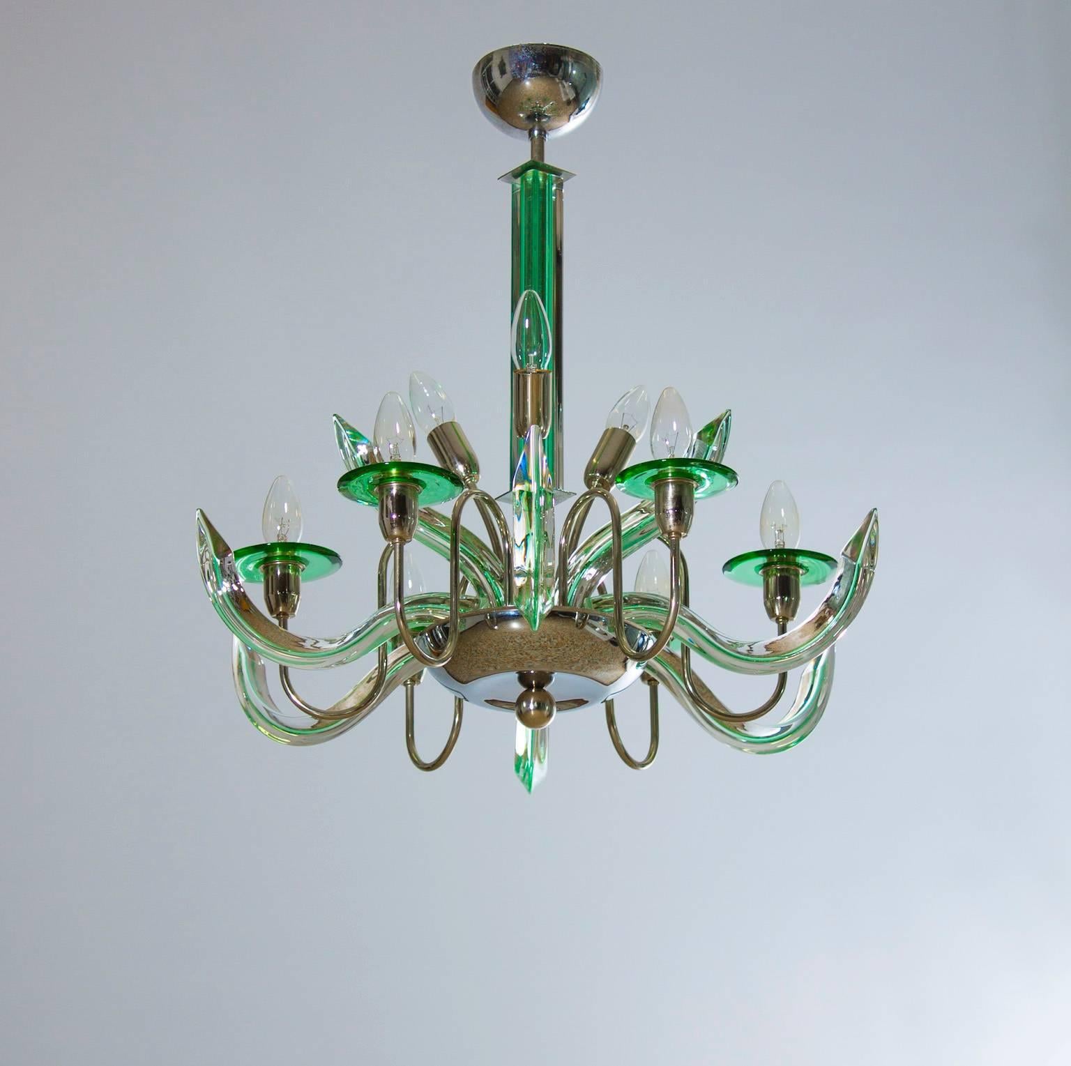 Italian Murano glass Chandelier in transparent and green color, in excellent original condition attributed to Camer Glass circa late 1960, composed from six beautiful curved Triedro elements in glass with green souls disposed between six metal