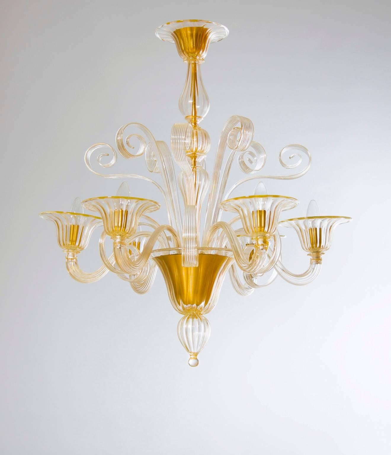 Crafted Blown Murano Glass Chandelier adorned with Gold Pastorals 1990s Italy.
Modern Italian Murano chandelier in gold blown Murano glass, composed by our high pastorals that look up inside, and by four high pastorals that look up outside, and six