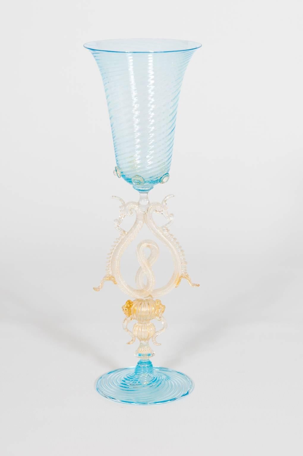Unique elegant Italian Venetian handblown Goblet in Murano glass in very excellent original condition, circa 1970s having a light-blue base and a stem in gold with very sophisticated artistic working and a light-blue cup on the stem. The globet is