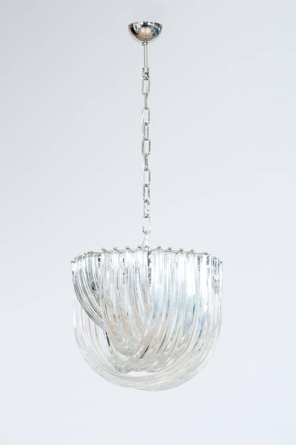 Italian Venetian Curves Flush Mount blown Murano Glass, transparent, 20th
It is a fantastic chandelier, composed by four layers of curves having a tried design, glass prisms on an octagonal chromed framework. The composition of the four layers,