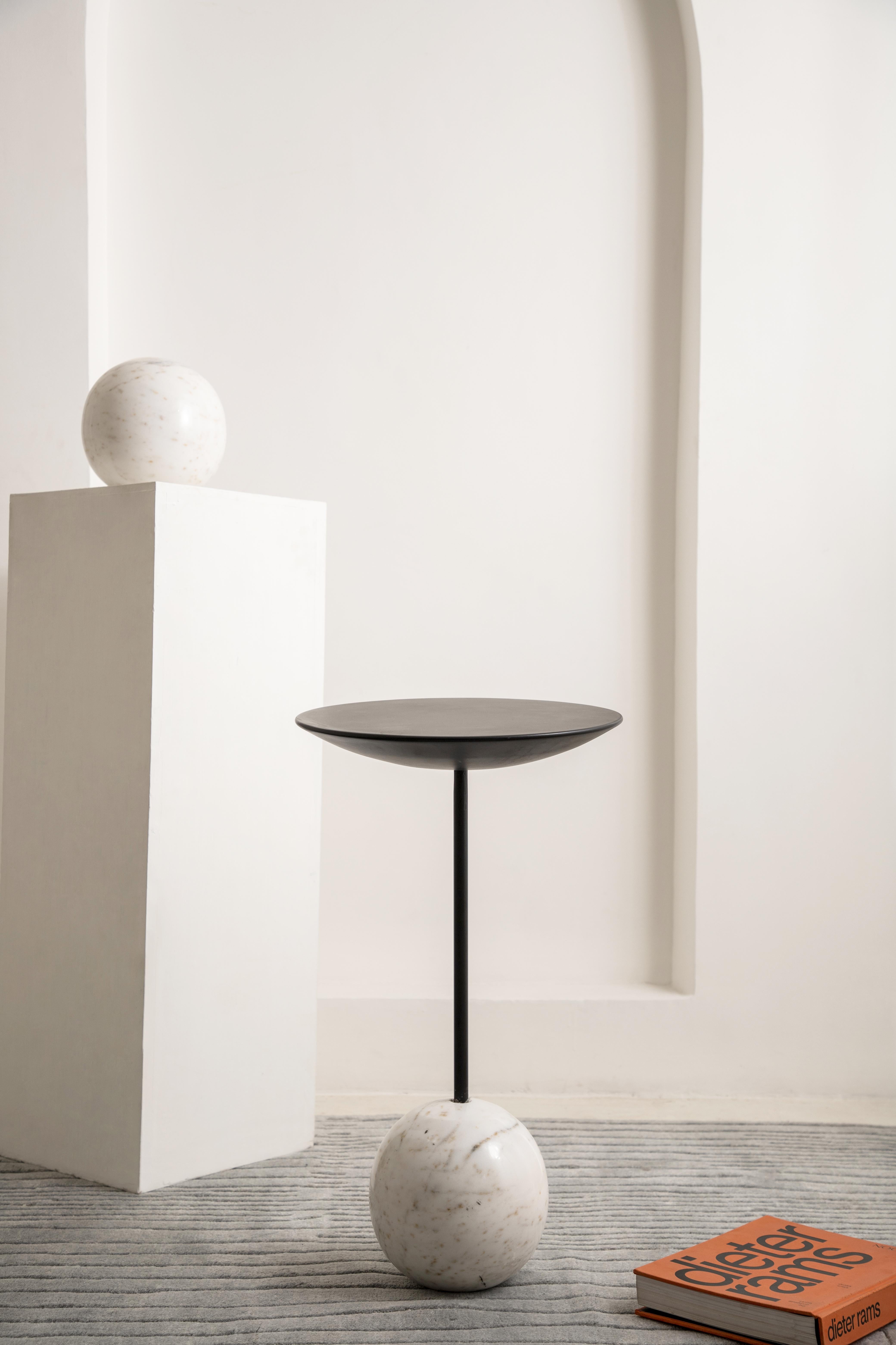 Bold in its form and timeless in appeal, the Ball End Table is a chic matte black piece designed to bring visual weight and elegance to any space. With its chunky solid marble top and sculptural base, it serves as both a functional surface and a