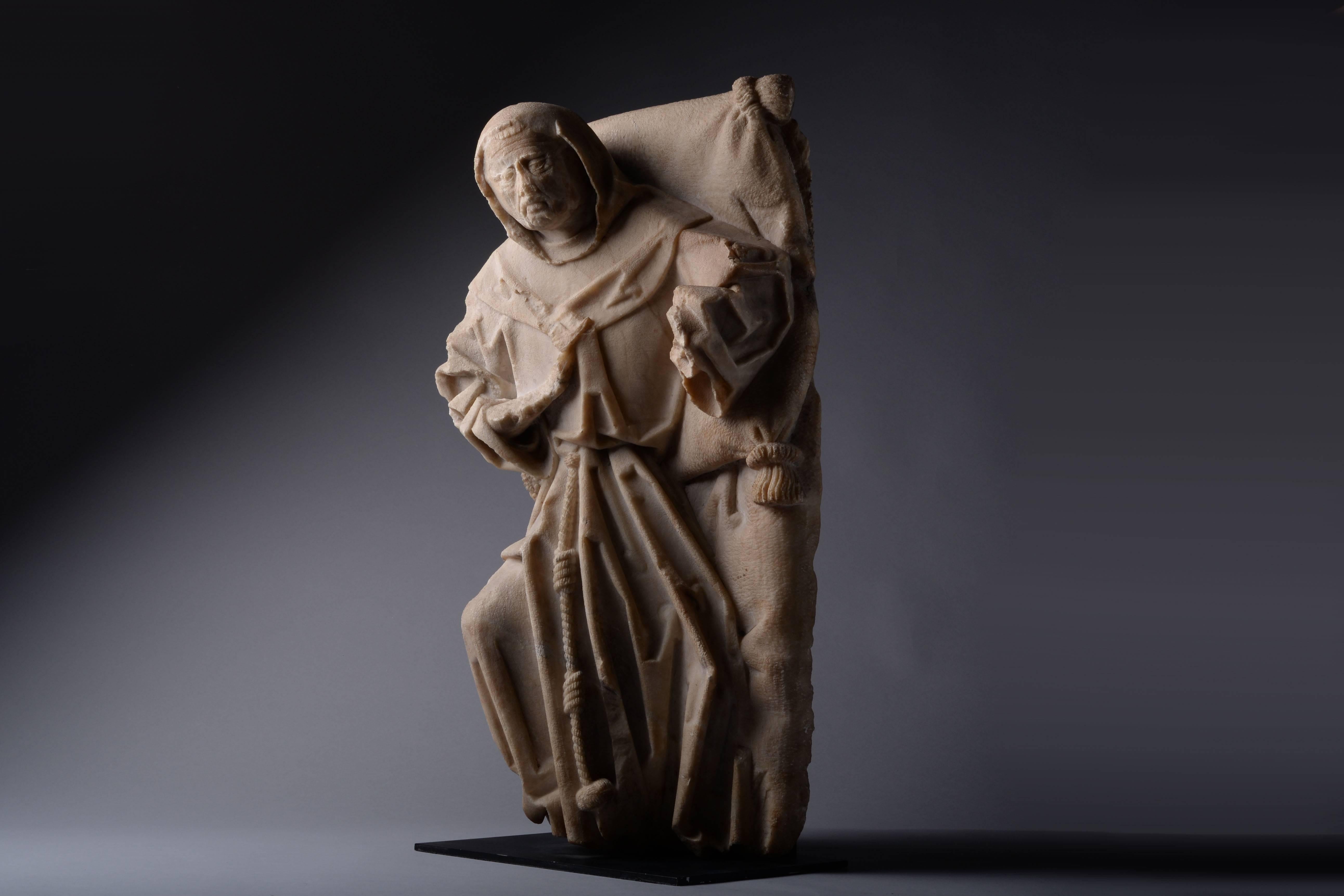 A carved alabaster figure of a Franciscan monk, from Antwerp and dating to 1480 – 1520 AD.

This stunning piece is a reflection of late medieval sculpture at its finest. Clearly influenced by the late medieval German school, this figure depicts a