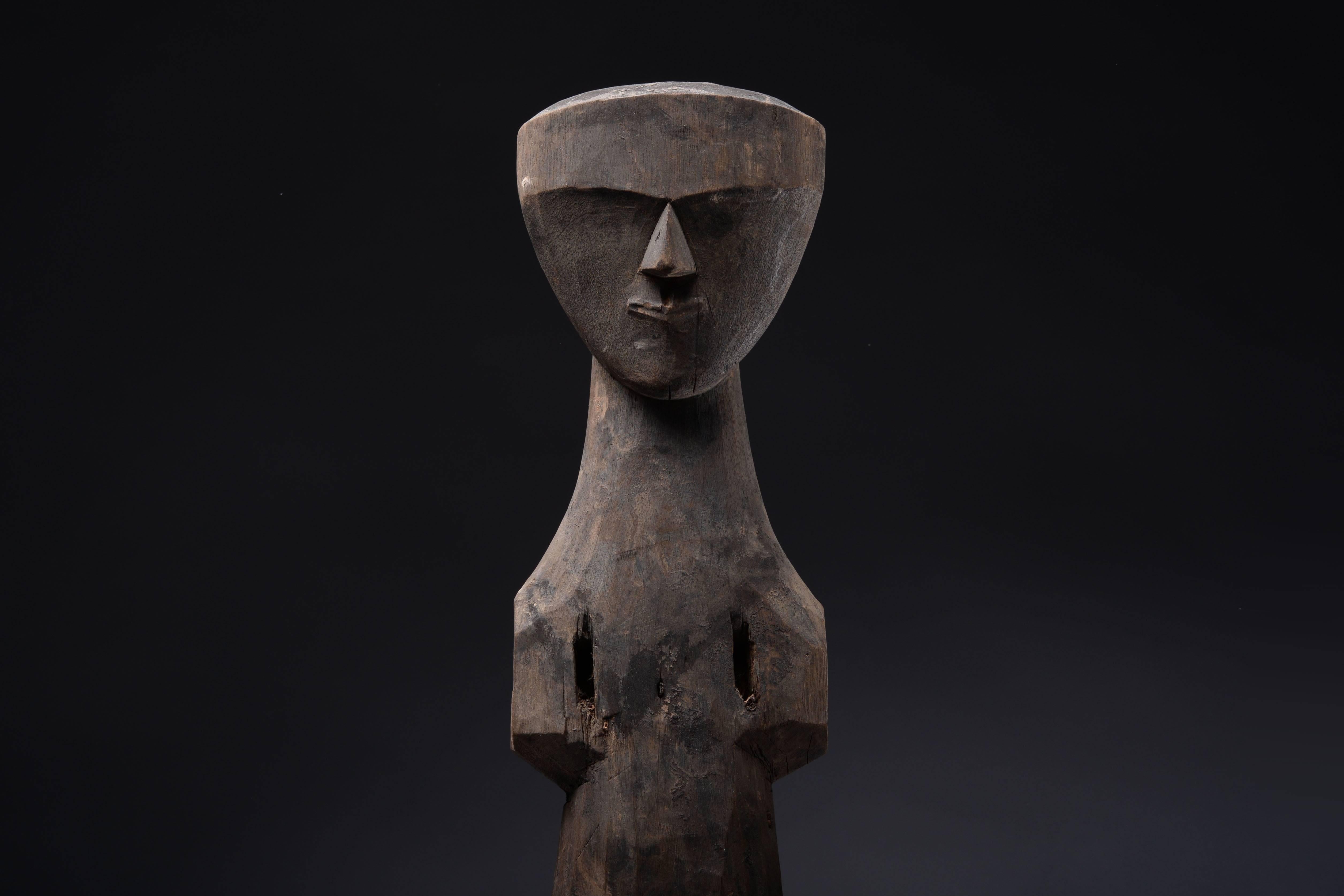 An ancient Chinese wooden figure, dating to the Chu Kingdom, 4th - 3rd century BC.

A striking piece of abstract ancient sculpture. Skilfully carved from a beautiful piece of wood; the towering body leading to a slender neck and perfectly