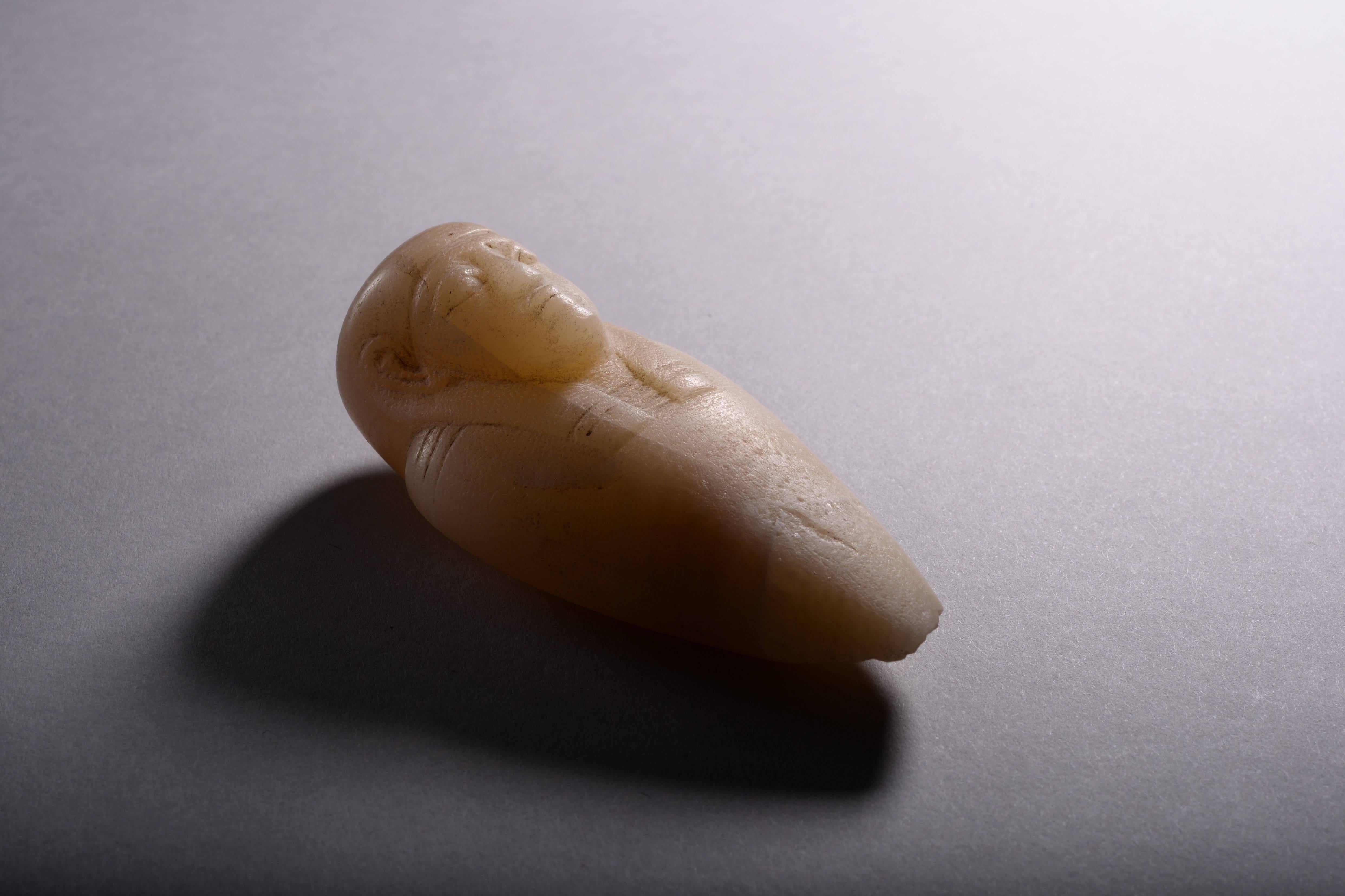 A rare ancient Egyptian anthropomorphic heart amulet, dating to the late Period, 664-332 BC.

The large alabaster 'amulet' bears a resemblance to a shabti, however that is merely a superficial one. The piece in fact represents the shape the