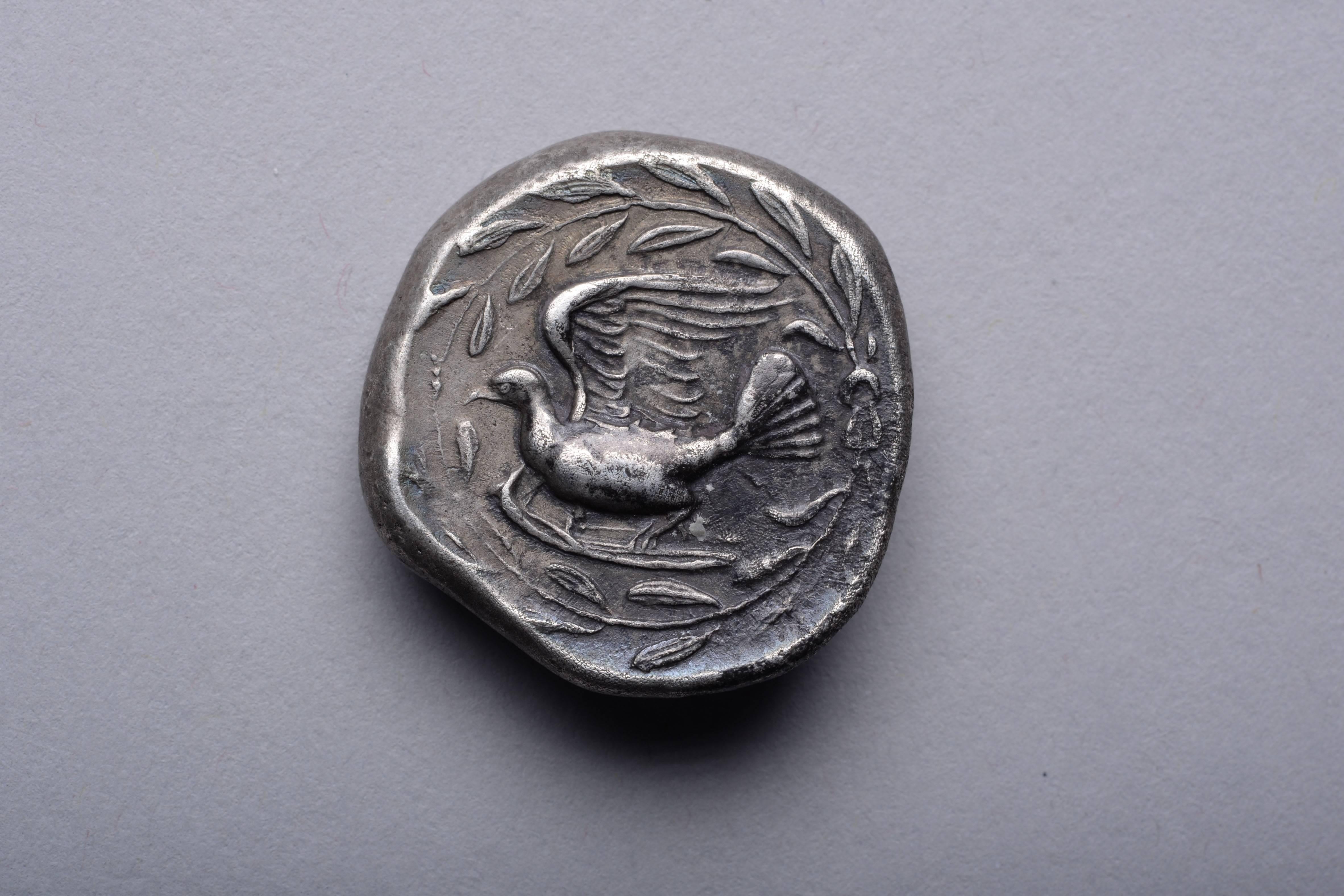 A superb example of one of the most graceful and artistic coin types of antiquity, struck from the most artistically accomplished obverse die that we have seen. An ancient silver stater from the city of Sicyon, in the northern Peloponnese, struck