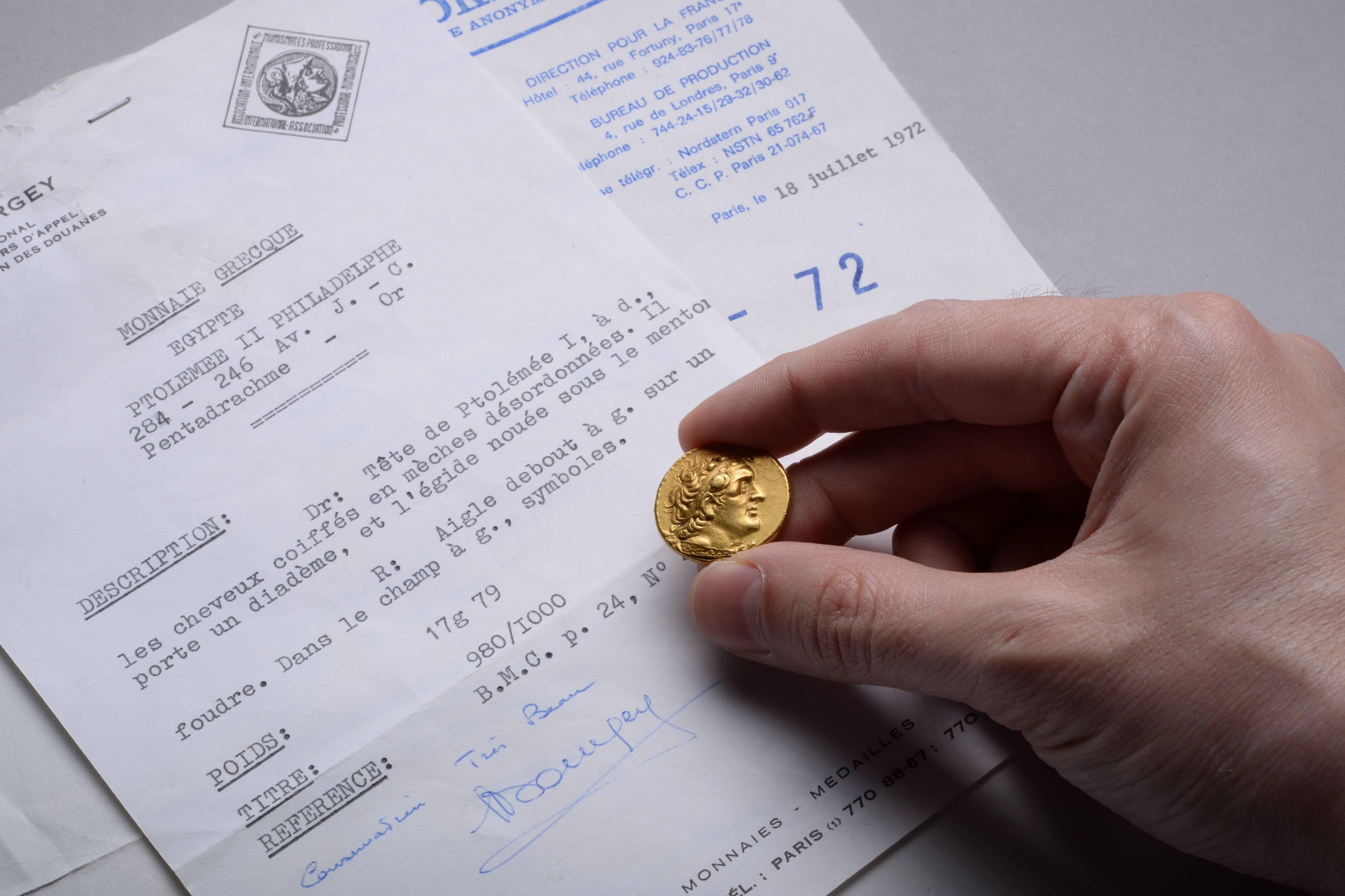 A rare and impressive solid gold pentadrachm. Minted under Ptolemy II of Egypt, in Alexandria, circa 274-272 BC.

The obverse of the coin shows a magnificent portrait of the founder of the Ptolemaic Kingdom and friend of Alexander the great,