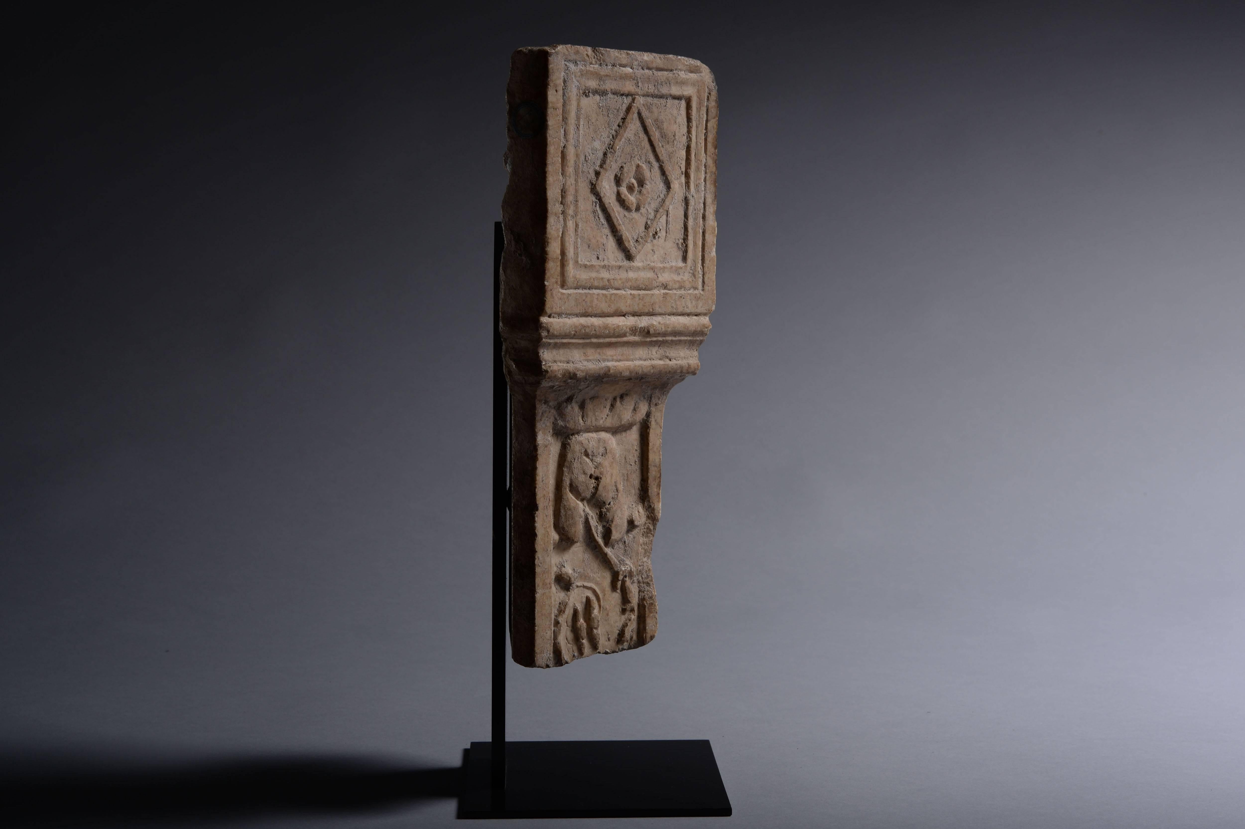 A fragment of a Roman pilaster, dating to the 2nd century AD.

Beautifully carved in marble and decorated with scrolling acanthus leaves and tendrils.

Pilasters are decorative pillars and were used by the Romans to embellish grand villas. This