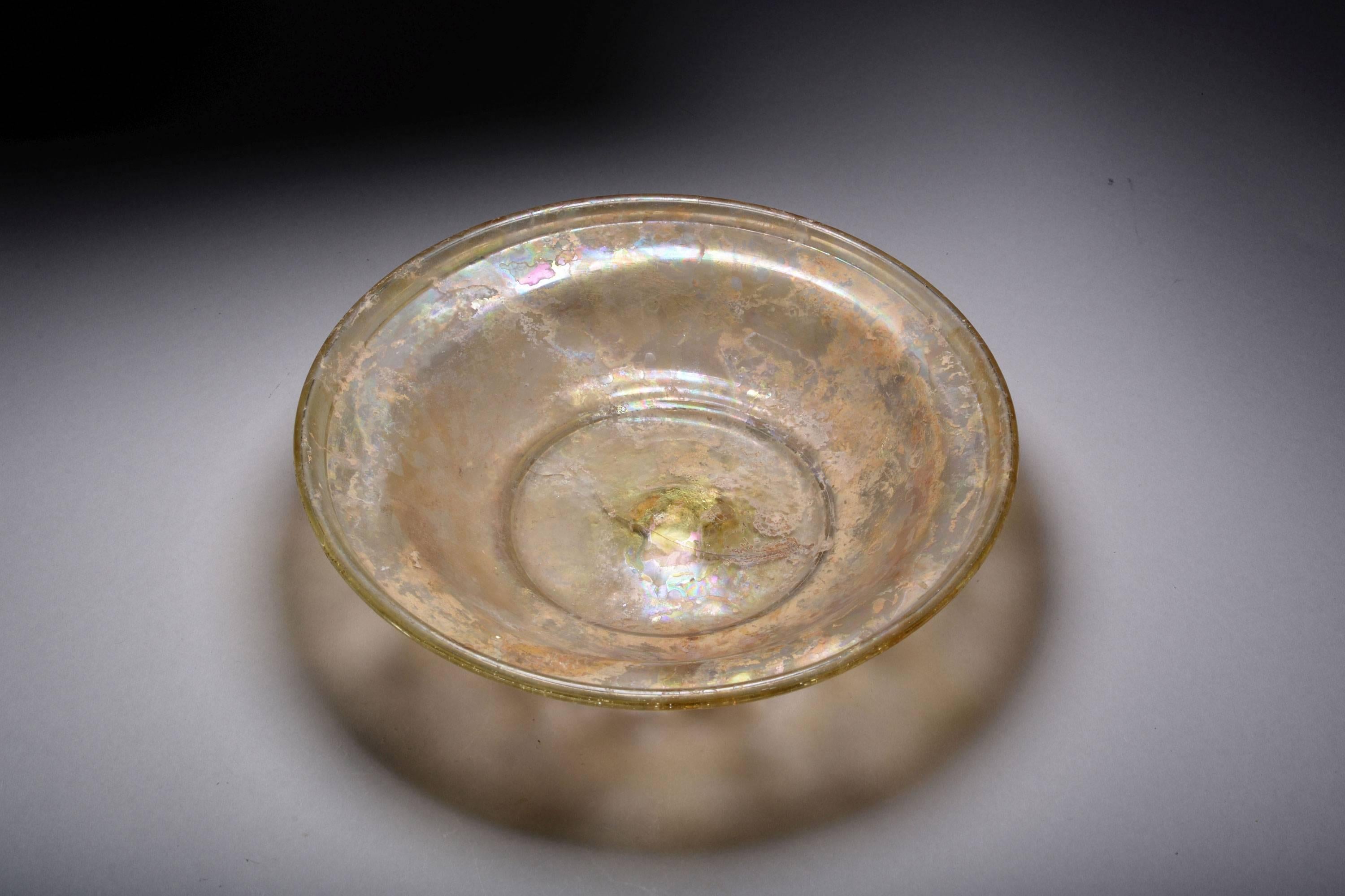 An ancient Roman glass serving dish, dating to 350–500 AD.

A beautifully balanced glass dish and an exceptional example of its type. Although the elite of society would eat from gold and silver plates, many more used glass vessels for serving
