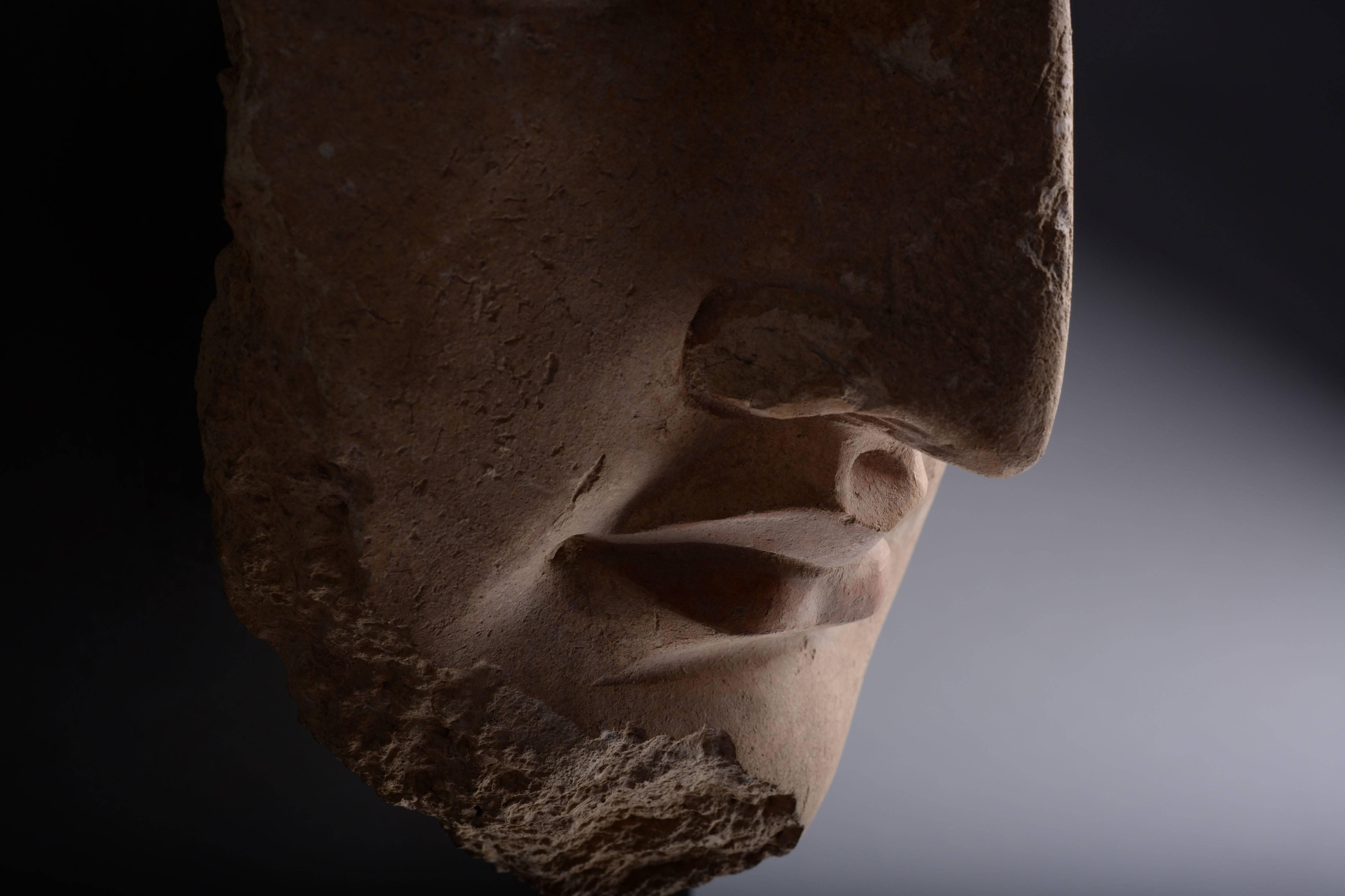 A magnificent, over lifesize Gandharan sculpture of Buddha, dating to the 4th Century AD.

Gandharan stucco sculpture rarely comes more beautiful than this sensuously modelled artwork. Depicted with large, heavy lidded eyes, aquiline nose and