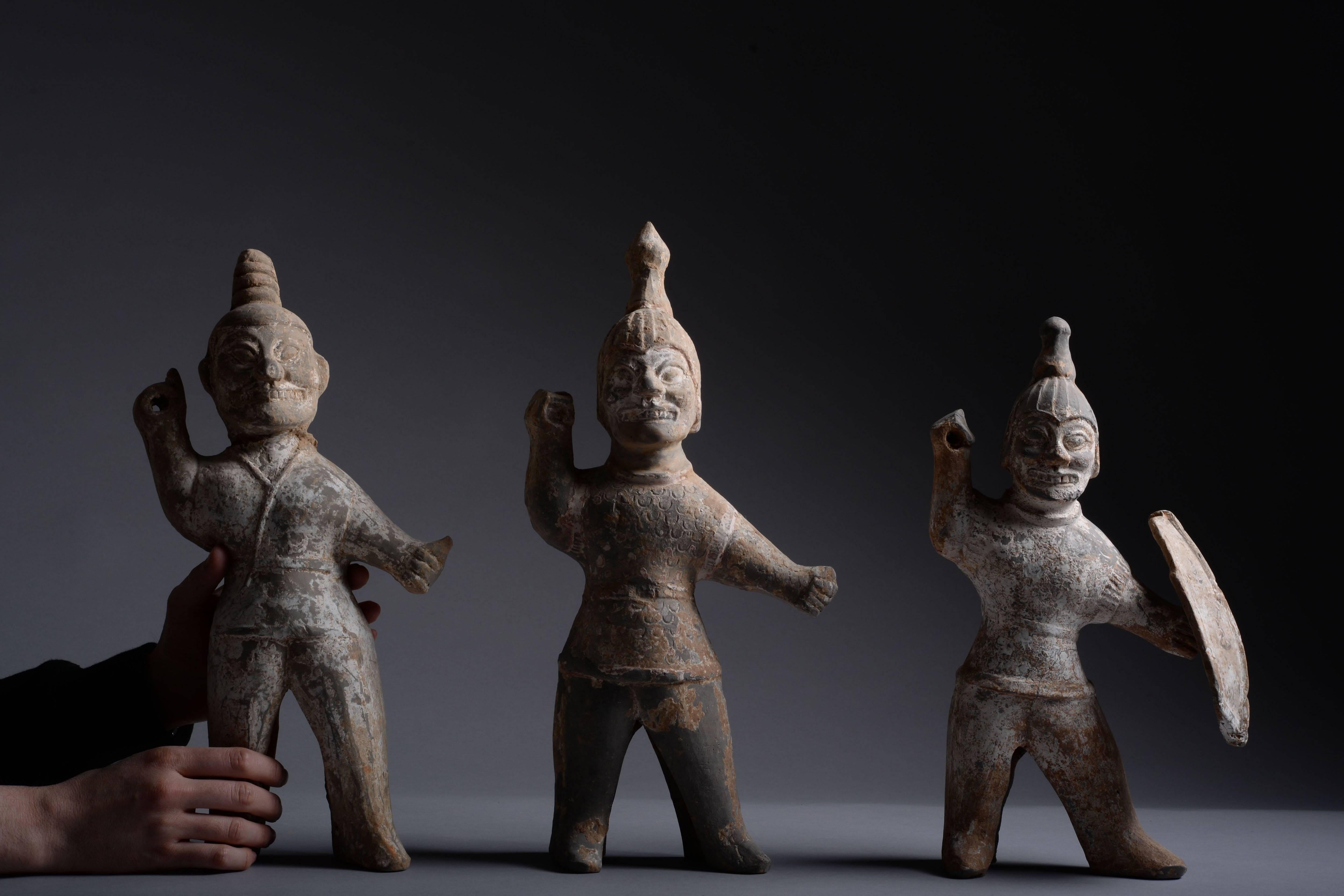 A group of three rare ancient Chinese terracotta warriors, dating to the Western Jin dynasty, 265–316 AD.

Western Jin terracotta figures such as these are some of the most distinctive mingqi known from ancient China. With their fierce, powerful