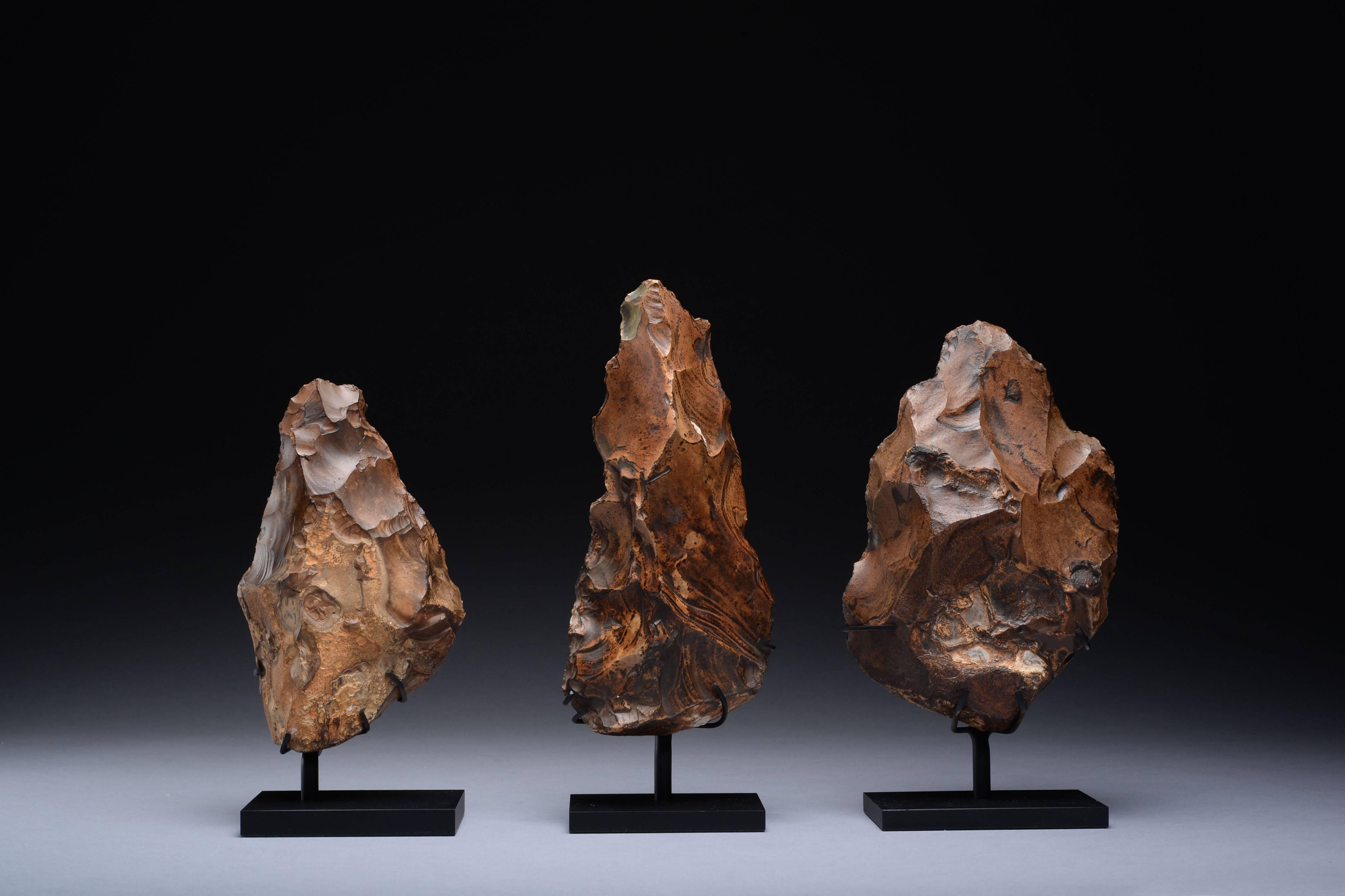 A collection of large Egyptian flint hand axes, made by Homo erectus, dating to the early-middle Paleolithic, circa 400,000-250,000 years ago.

Worked with care and precision, these artefacts go beyond the necessary and suggest an aesthetic sense