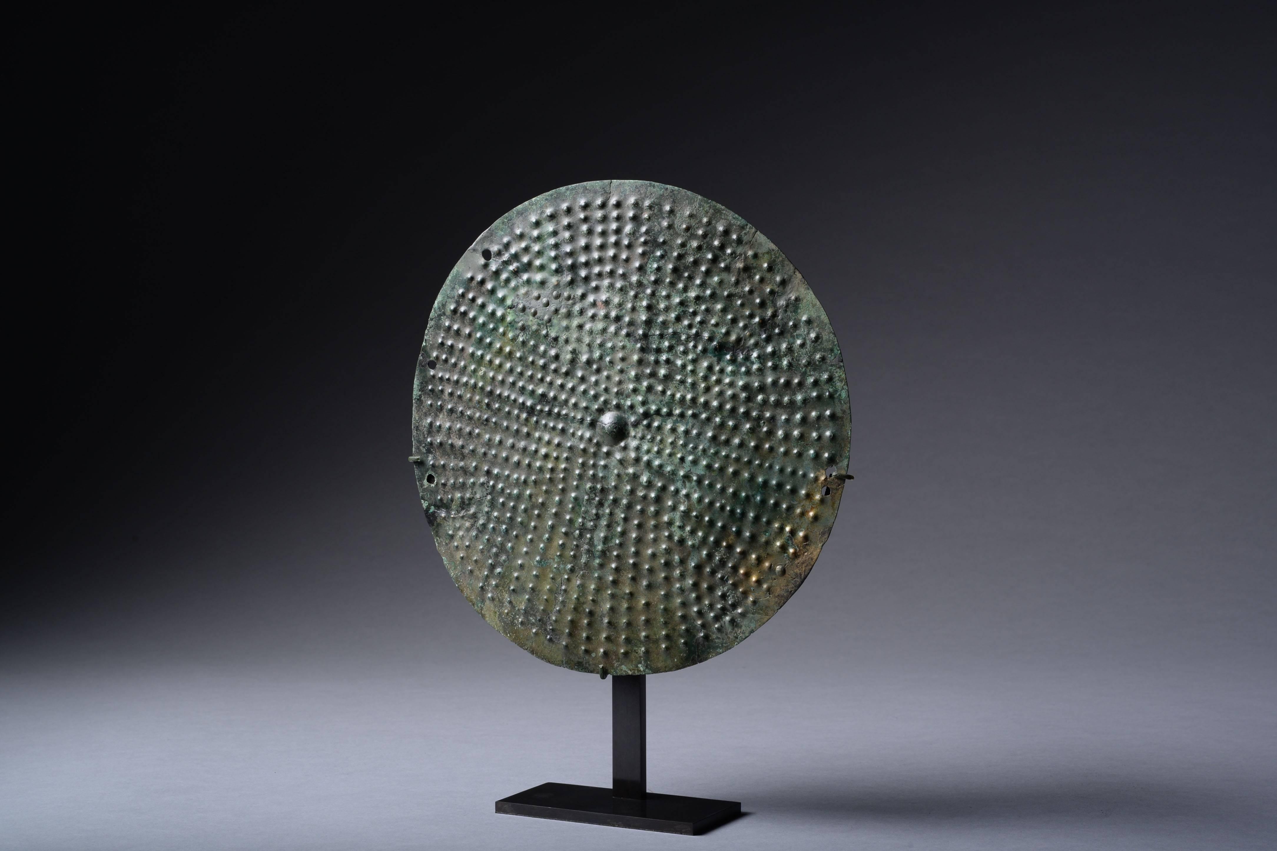 A rare ancient Etruscan shield boss, dating to the 7th - 6th century BC.

Hammered in positive relief from a sheet of bronze.

For a similar example on display at the Metropolitan Museum of Art, please see object 12.163.3, gallery 170.

 

A