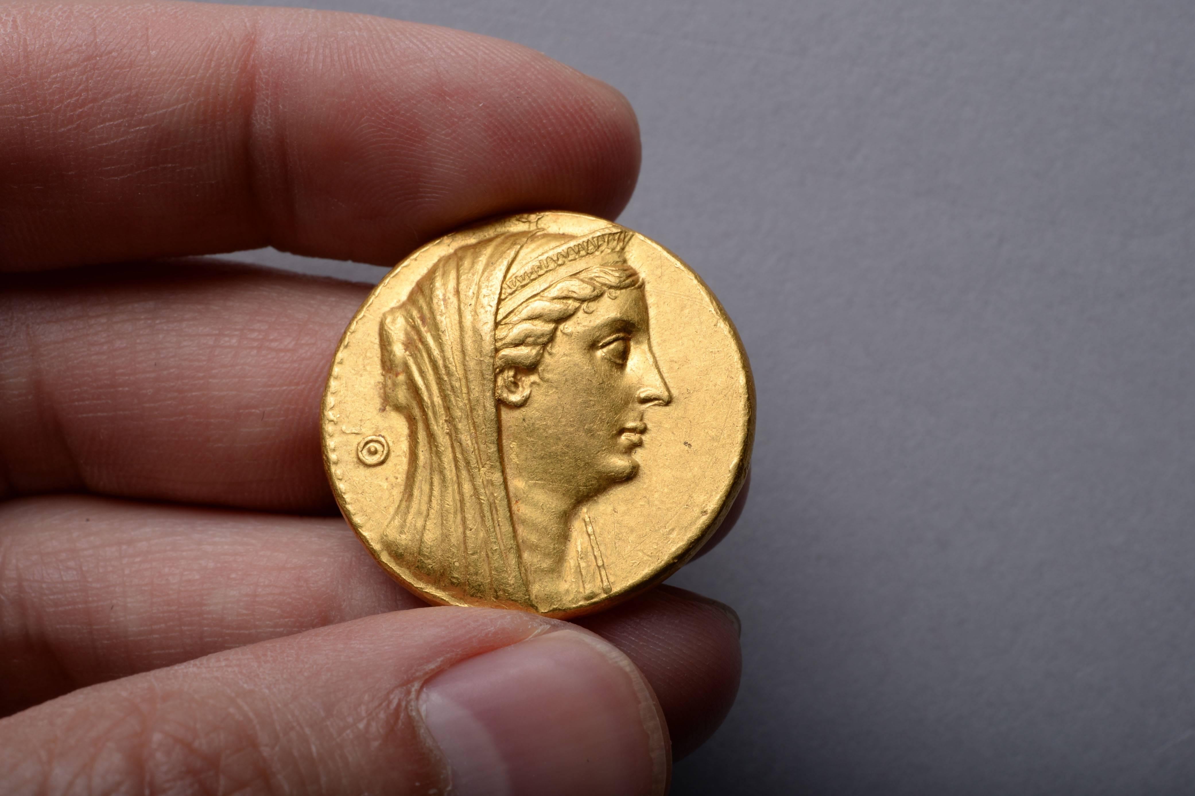 A superb example of the heaviest and most valuable gold coin from antiquity. A gold octadrachm issued under Ptolemy II Philadelphus 'sibling lover', in honour of Queen Arsinoe II. Struck at the Alexandria mint, circa 253 - 246 BC.

The obverse