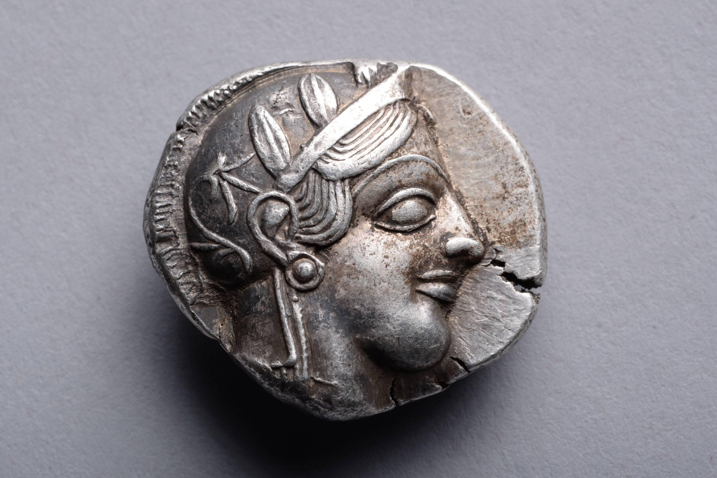 A fine style example of one of the most iconic and important coin types from the ancient world. A silver tetradrachm from Athens, struck circa 454-404 BC.

The obverse depicts Athena, patron to Athens city state. She wears a helmet ornamented with