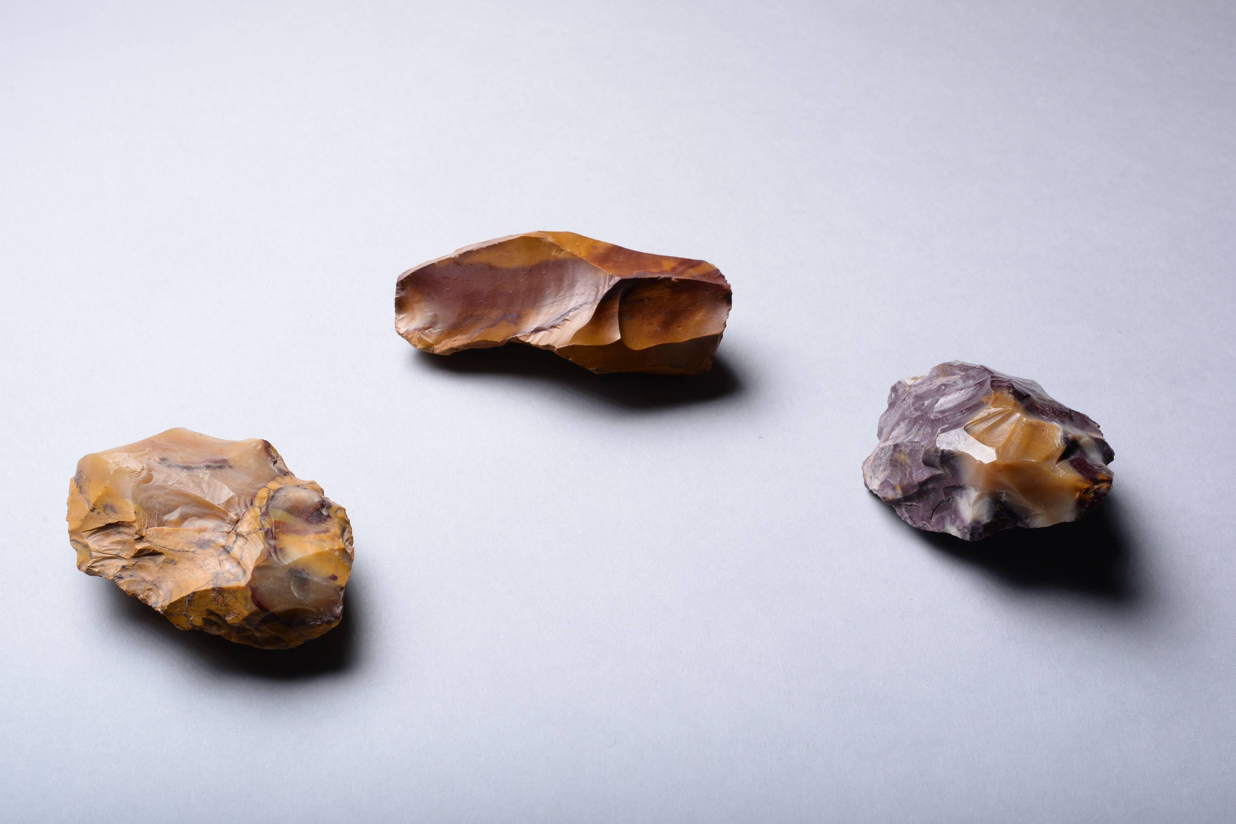 A collection of yellow, red and purple jasper Mousterian tools from Fontmaure, central France. Dating circa 80,000 - 40,000 years ago. 
 
These tactile pieces of semi precious stone were used to prepare animal hides and butcher meat. Tools made
