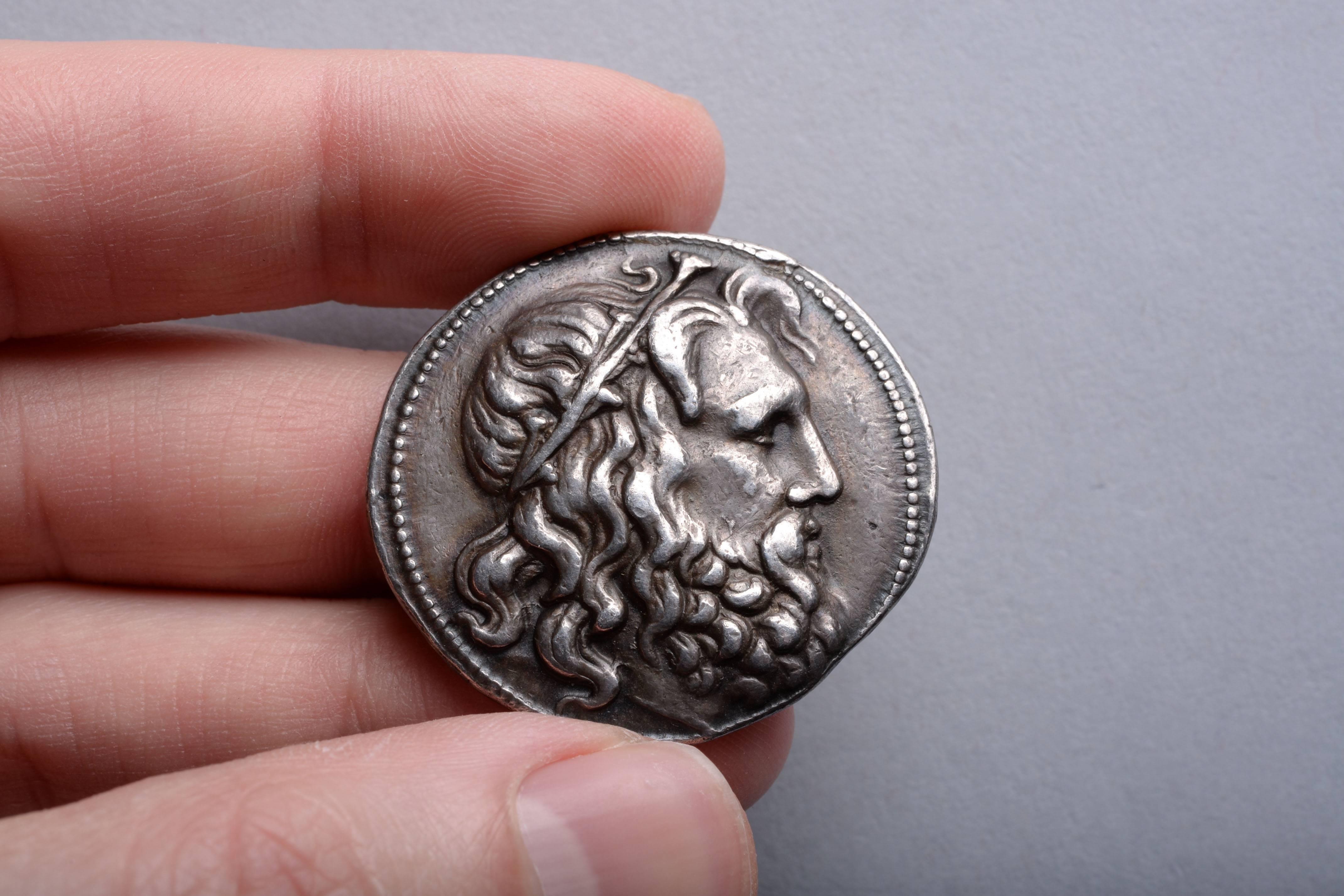 An impressive ancient Greek silver coin with a fantastic example of Hellenistic portraiture.

A tetradrachm minted under King Antigonos III Doson (