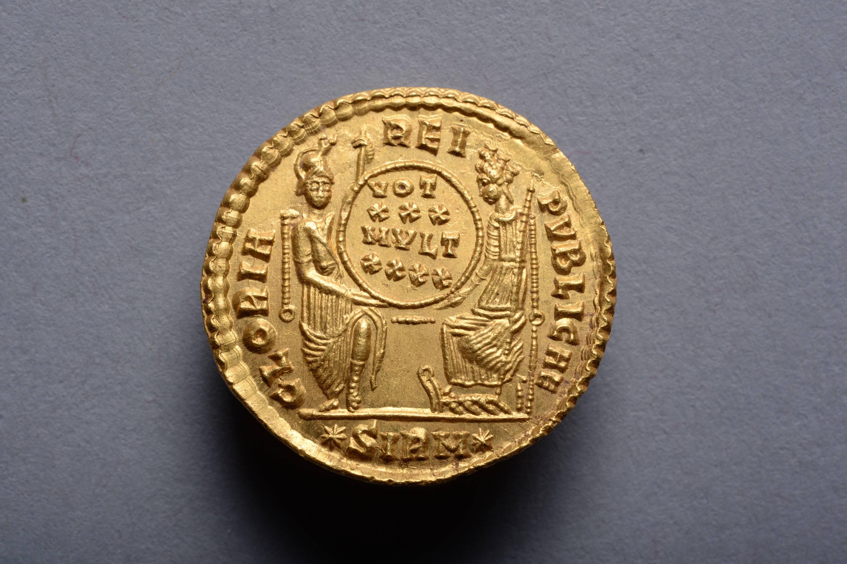 A superb example of ancient Roman gold coinage, in the finest state of preservation. A gold solidus issued under Emperor Constantius II (Flavius Julius Constantius Augustus), at the Sirmium mint, circa 353-354 AD.

The obverse with the Emperor