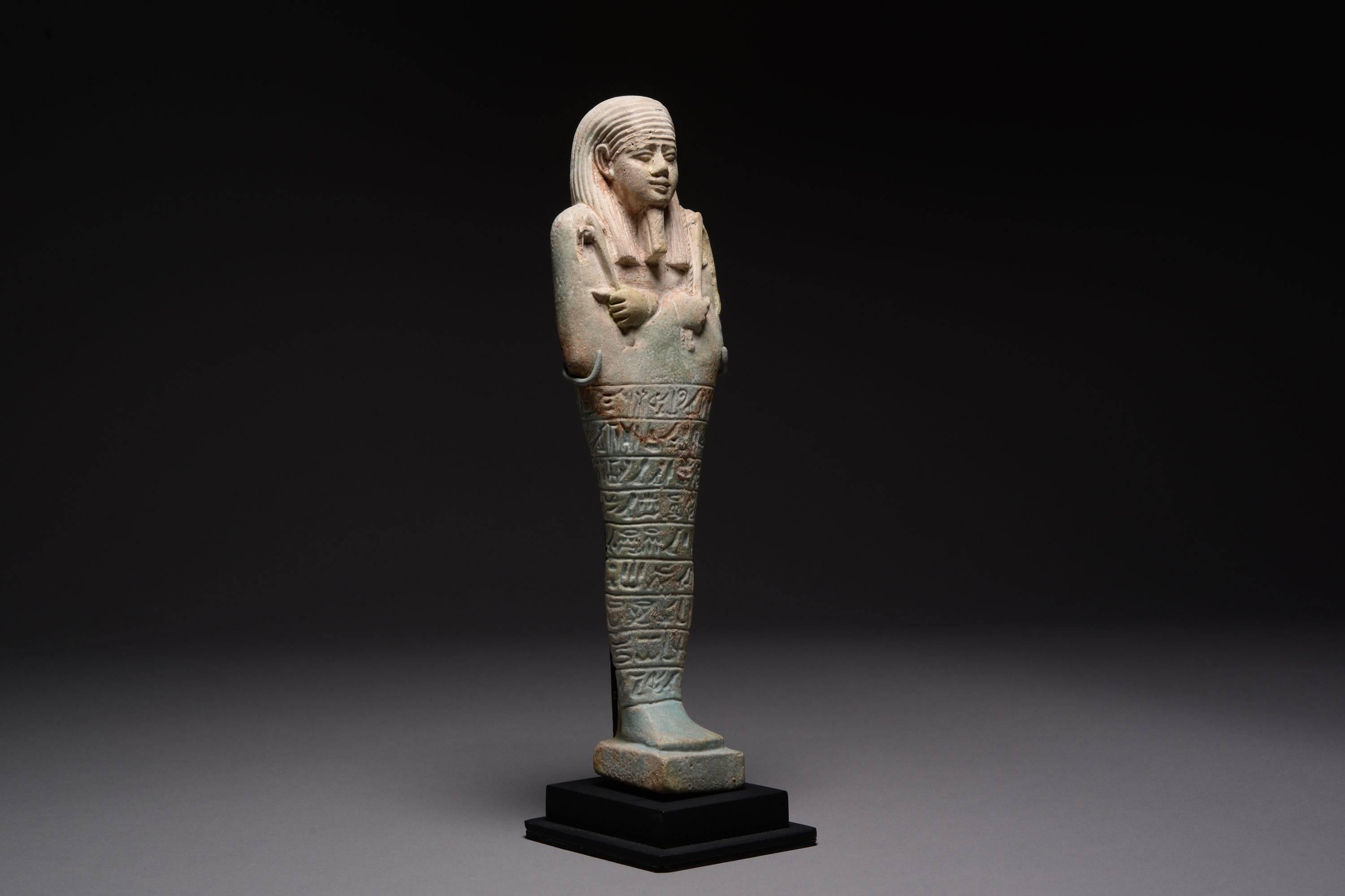 A very large ancient Egyptian faience shabti for Horudja, prophet of Neith, born of Shedet.  Dating to the Late Period, XXX Dynasty, circa 380-343 BC.

Amongst the largest shabties known from ancient Egypt, those of Horudja are also finely