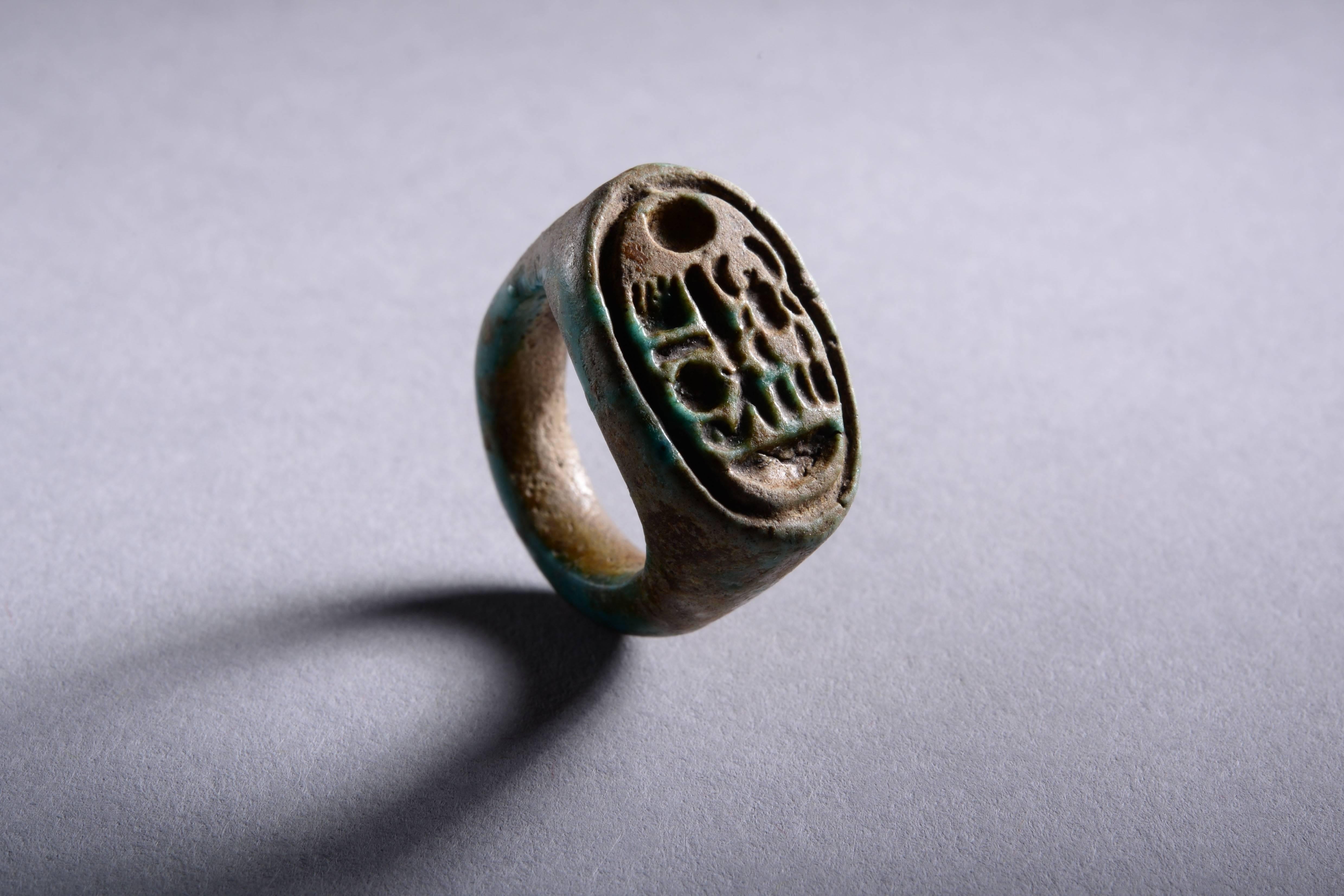 An ancient Egyptian faience ring, inscribed with the cartouche of Tutankhamun. Dating to the New Kingdom, XVIII Dynasty, 1332-1323 BC.

Tutankhamun’s name was made famous by Howard Carter, when he discovered the king’s miraculously intact tomb in