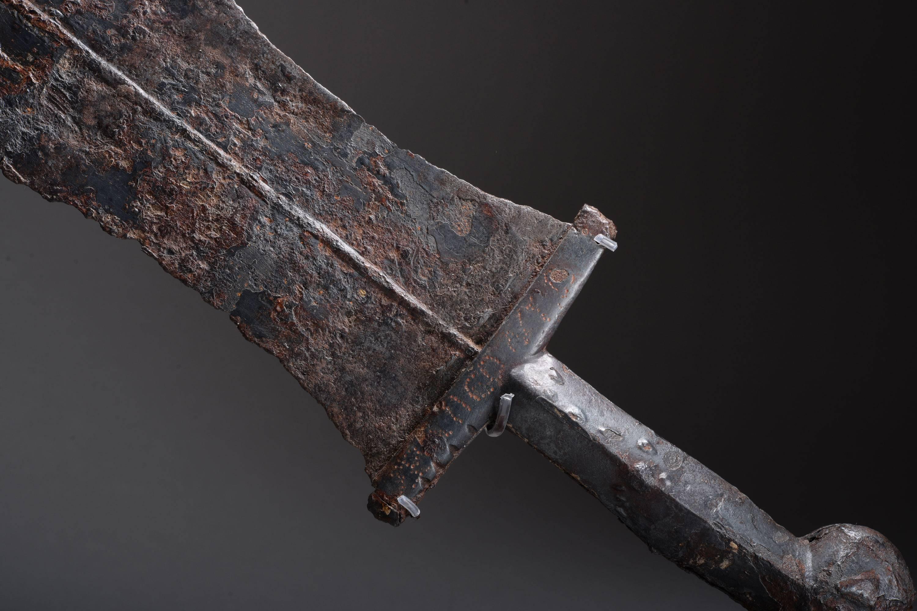 A rare ancient Roman iron dagger, called a Pugio, dating to the first century AD.

The hilt with double lobed pommel, four-sided handle and thick crossbar. The typical blade curving inwards, then bulging slightly before terminating in a gentle