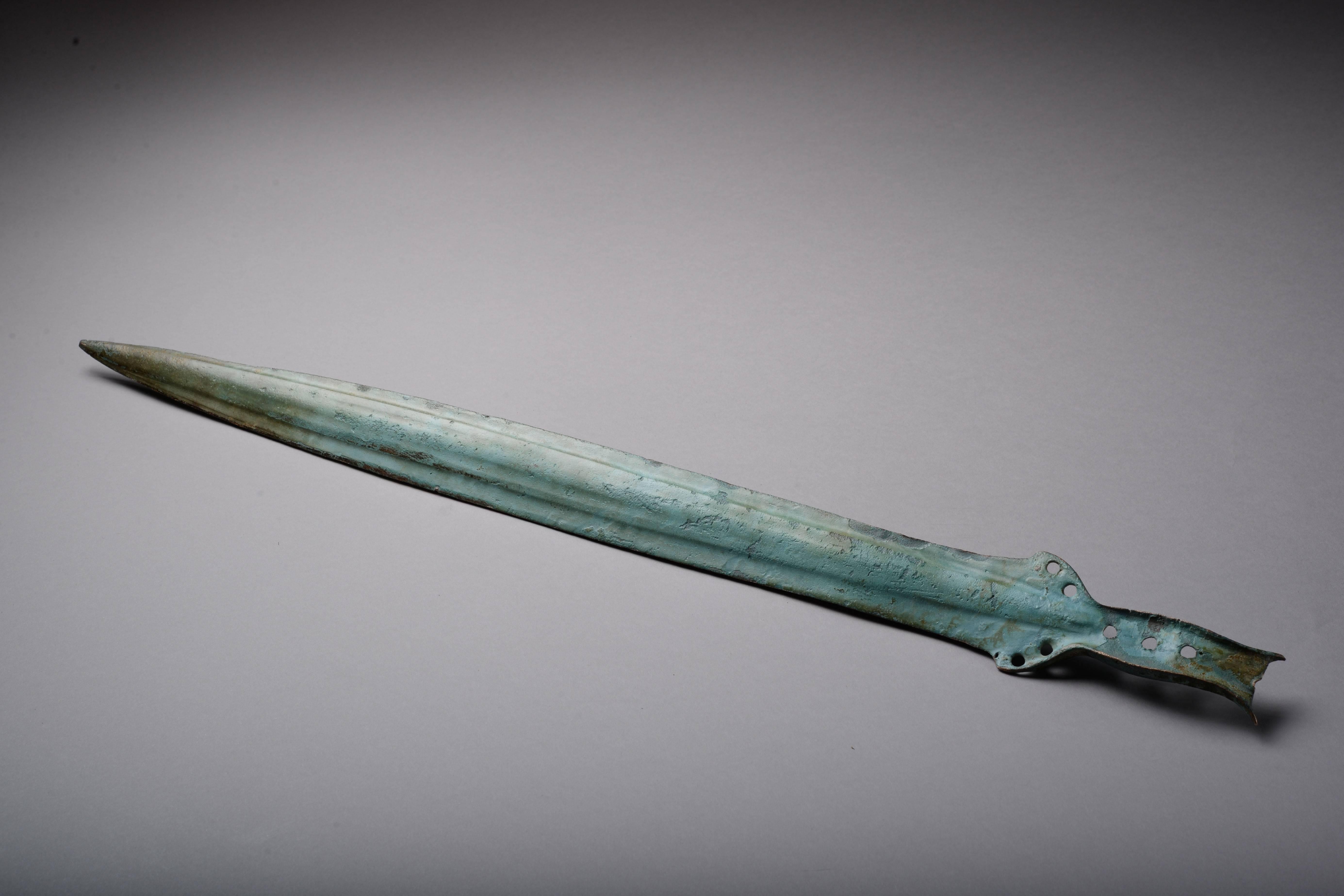 An ancient European Bronze Age sword with a beautiful patina, dating to circa 1400 BC.

Swords such as this were not only weapons, but great status symbols.  They were flung into rivers, buried in mounds, some even ritually broken, in order to win