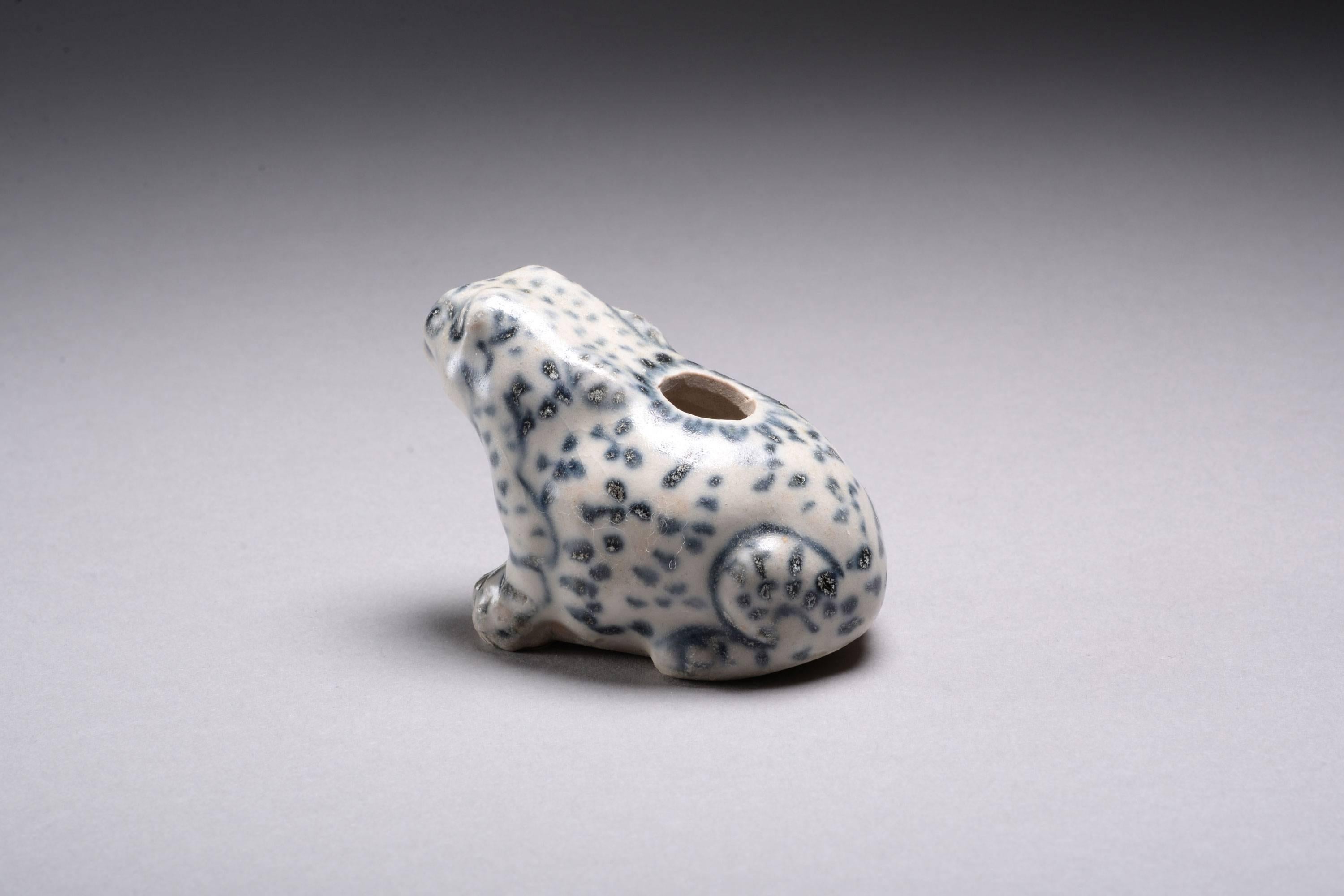 A finely painted, very well preserved water dropper, officially salvaged and recorded from the famous Hoi An hoard shipwreck, dating to around 1450 AD. 

This charming little water dropper is modelled in the form of a crouching frog, seemingly