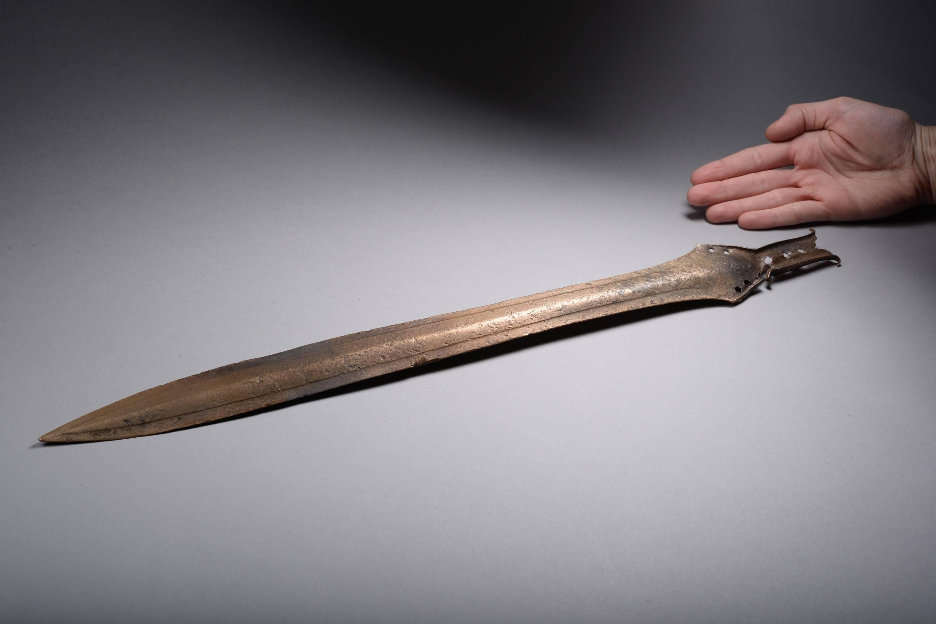 An ancient European Bronze Age sword, with a beautiful honey brown patina, dating to approximately 1400 BC.

Swords such as this were not only weapons, but great status symbols.  They were flung into rivers, buried in mounds, some even ritually