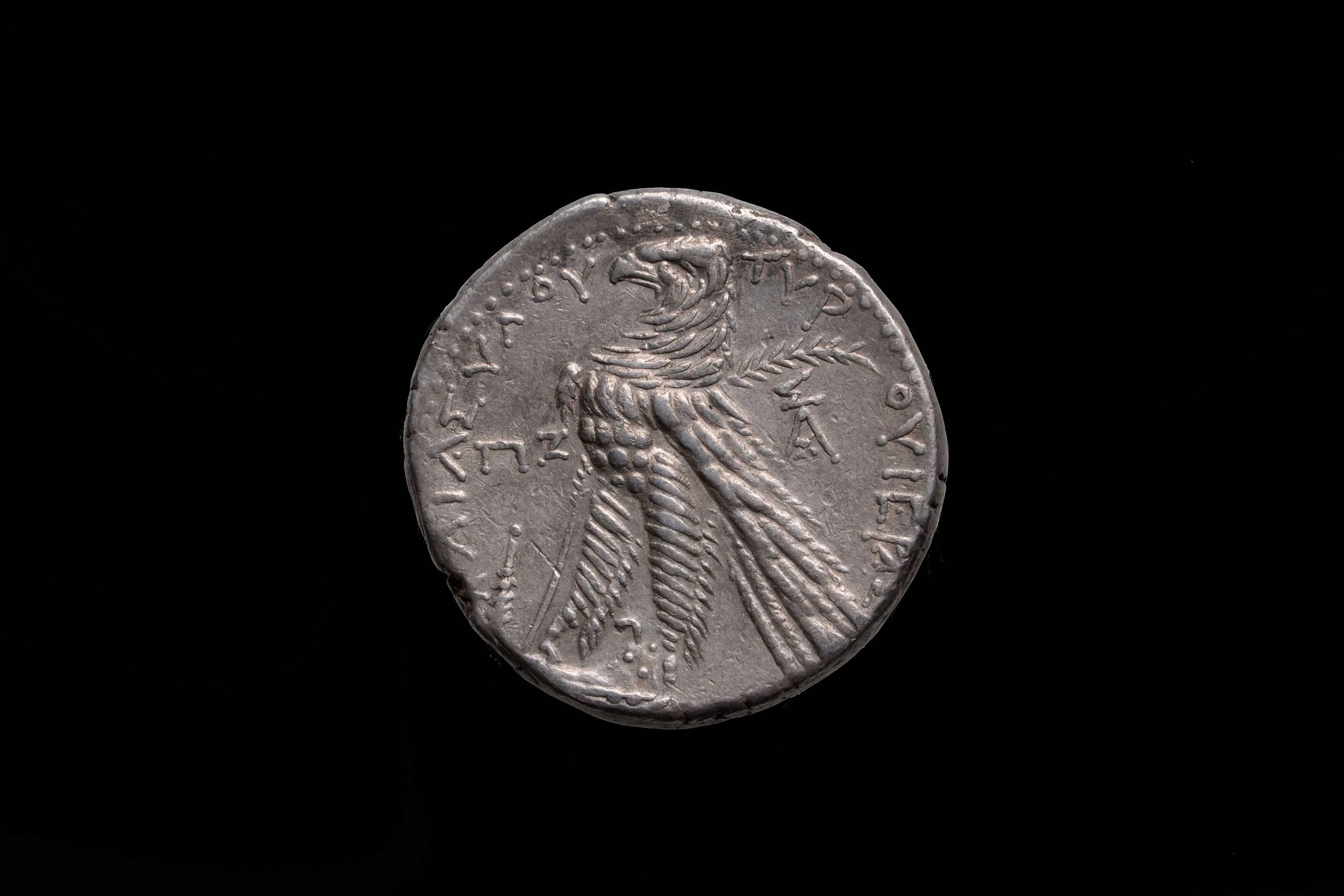 An ancient silver shekel from the city of Tyre, minted in year 87 of the Tyrian calendar or 40/39 BC.

The obverse with the portrait of the god Melqart (chief deity of Tyre). He is shown, facing right and wearing laurel wreath.

The reverse with