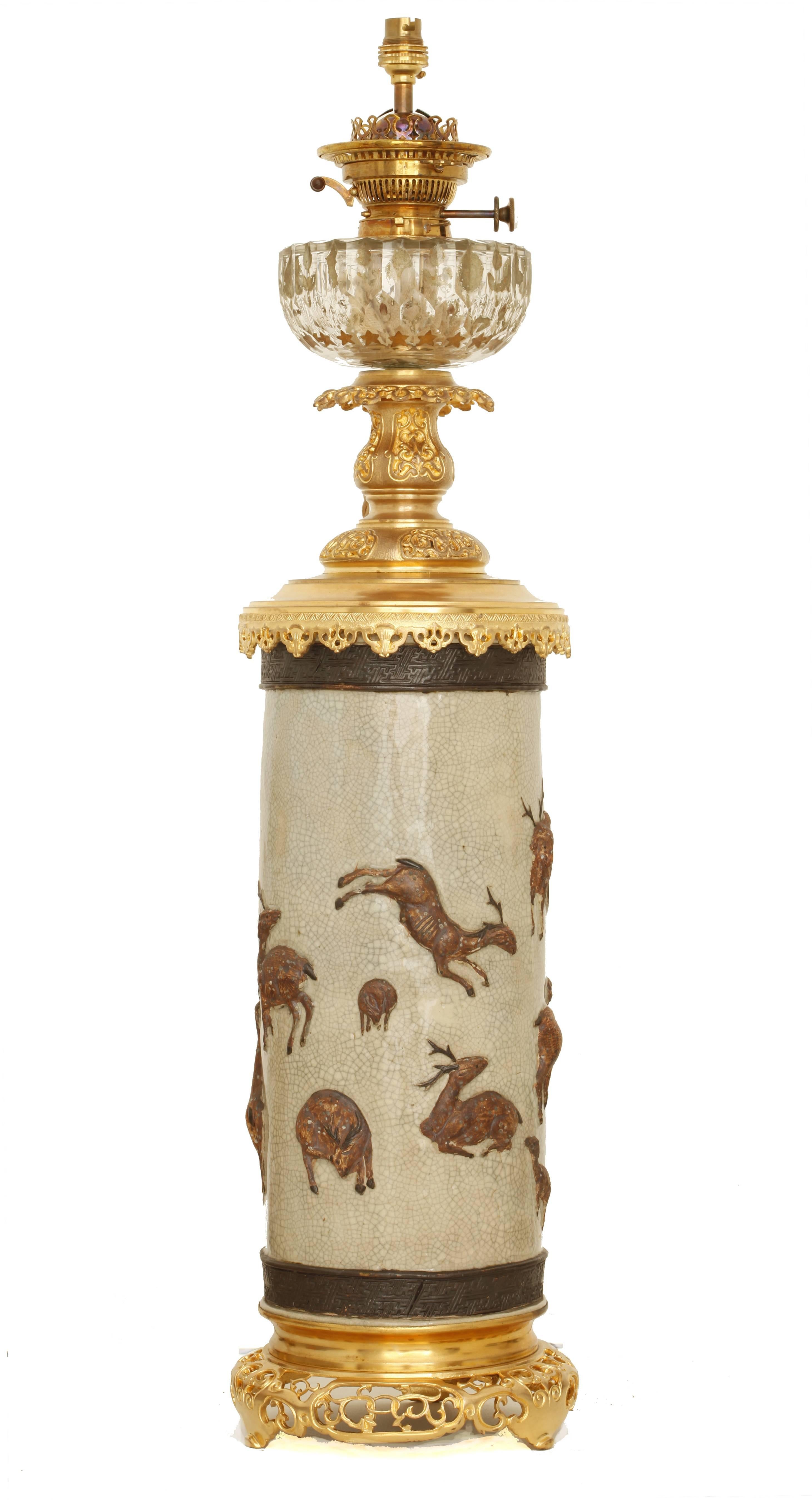 Bronze oil lamps crystal, mounted from a Nankin 19th century Chinese vase carved and chiseled. 
Brown and celadon green ceramic, with deers, hinds and fawns... gilded bronze base, cut-glass.
Mounting electric current.
 