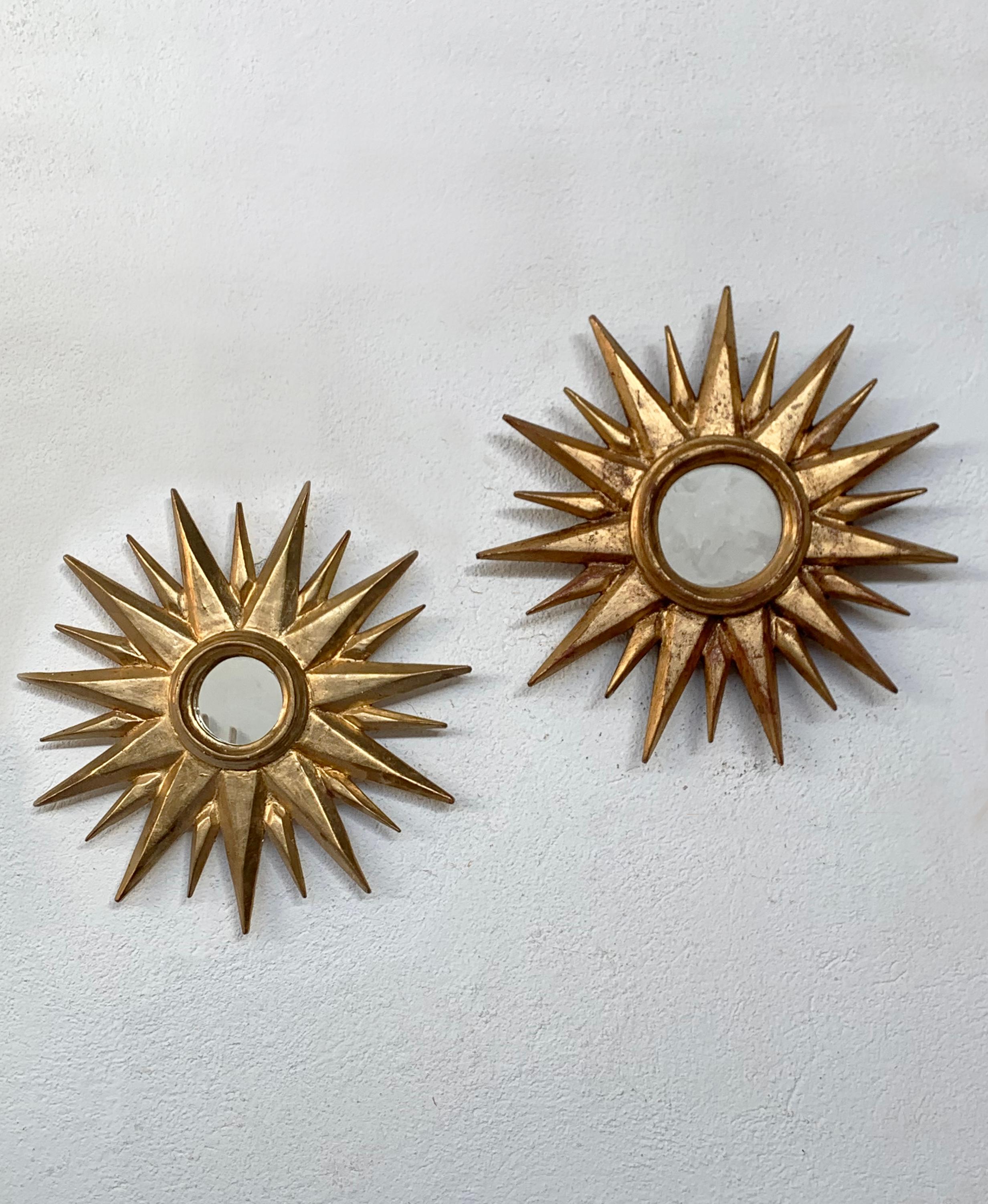 Vintage, fully handcrafted pieces finished with gold leaf. Each mirror features a unique arrangement of geometrical wooden rays, forming an elegant sunburst design. This charming pair is the perfect combination to add a magical and sophisticated