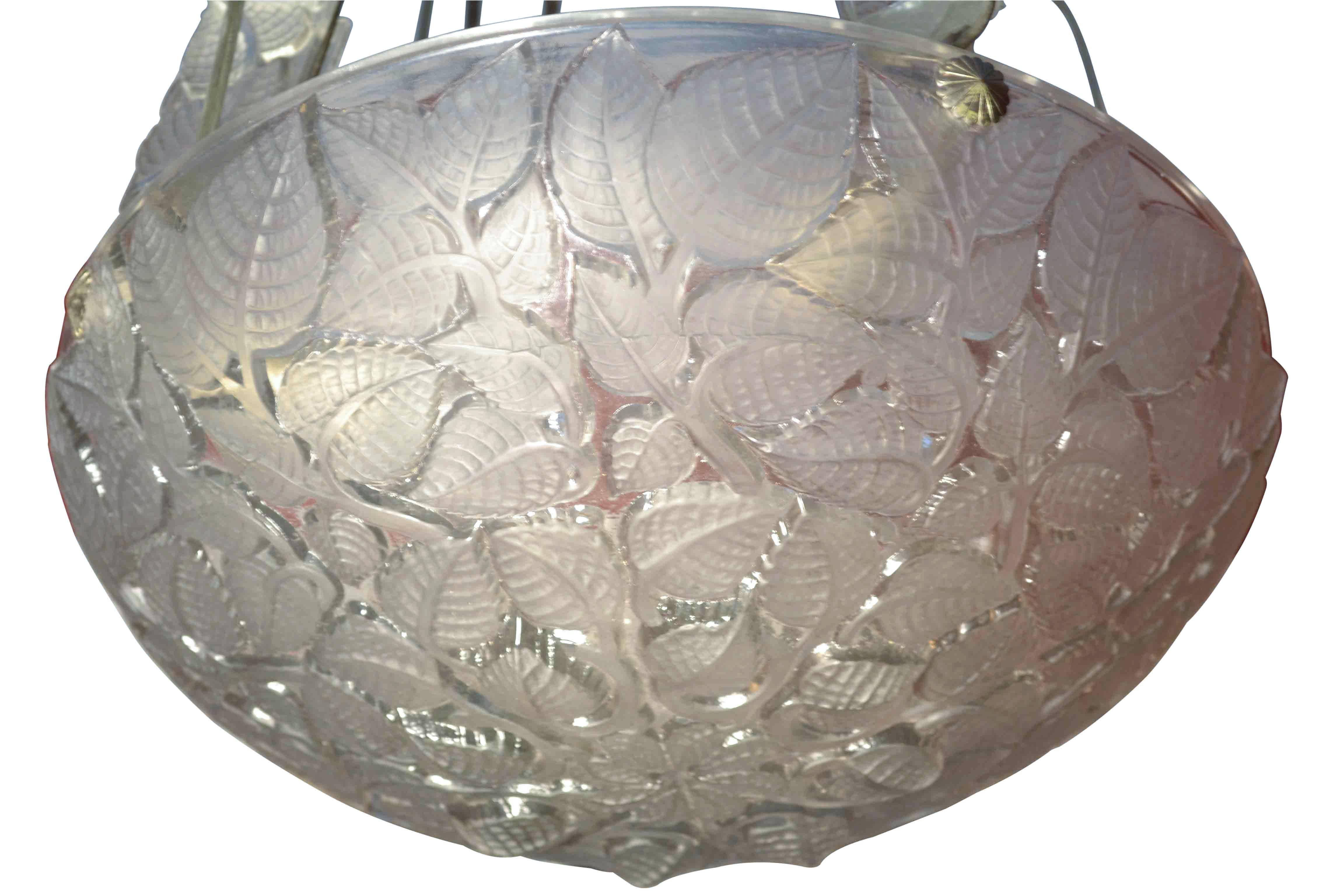 Charmes bowl fixture by René Lalique with frosted leaf pattern on a clear bowl, suspended by four iron links with rectangular glass plaques. Moulded 'R. Lalique' mark, bowl model No. 2458, designed 1924.