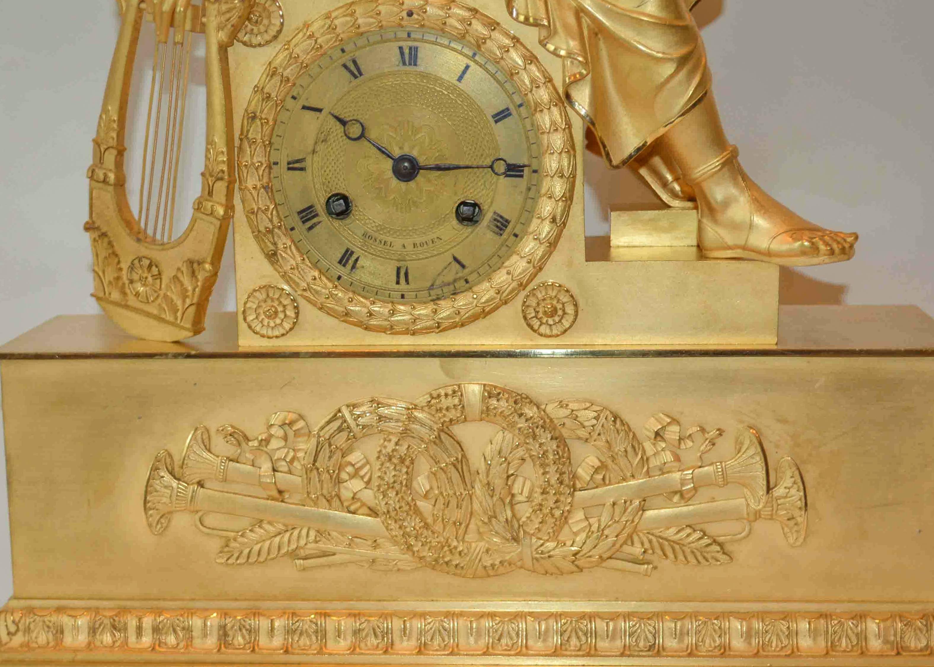 French Empire Clock of a Seated Youth Holding a Scroll and Lyre For Sale