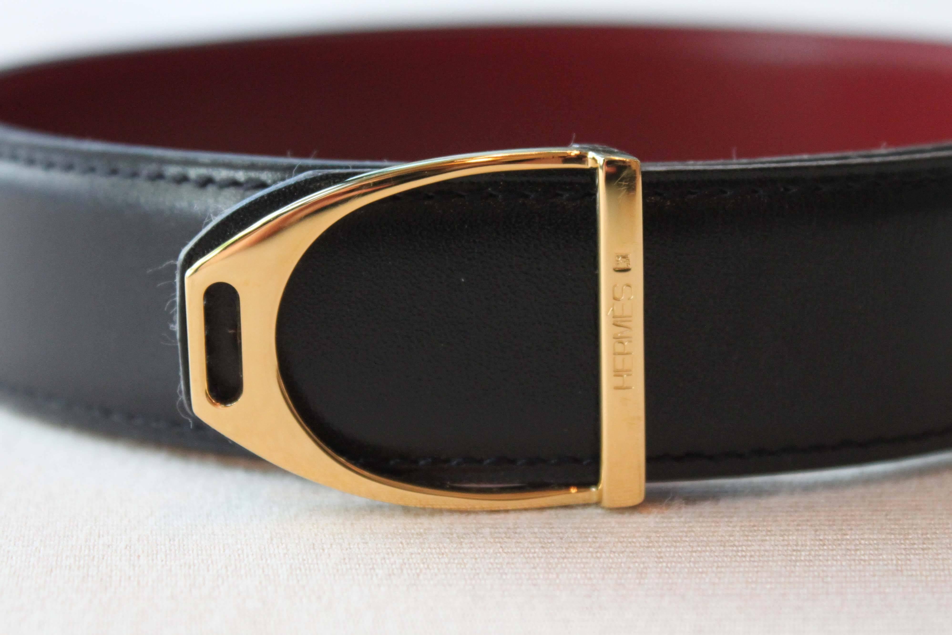 Hermès belt with reversible black and red leather and gold-plated 